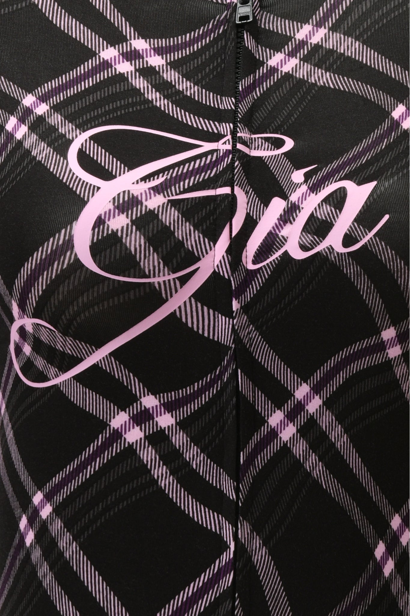 Close-up of the BLARE HOODIE - BLACK WARPED PLAID by I.AM.GIA, featuring black and pink plaid fabric with "Gia" elegantly scripted in pink across the center, highlighting its stylish design.