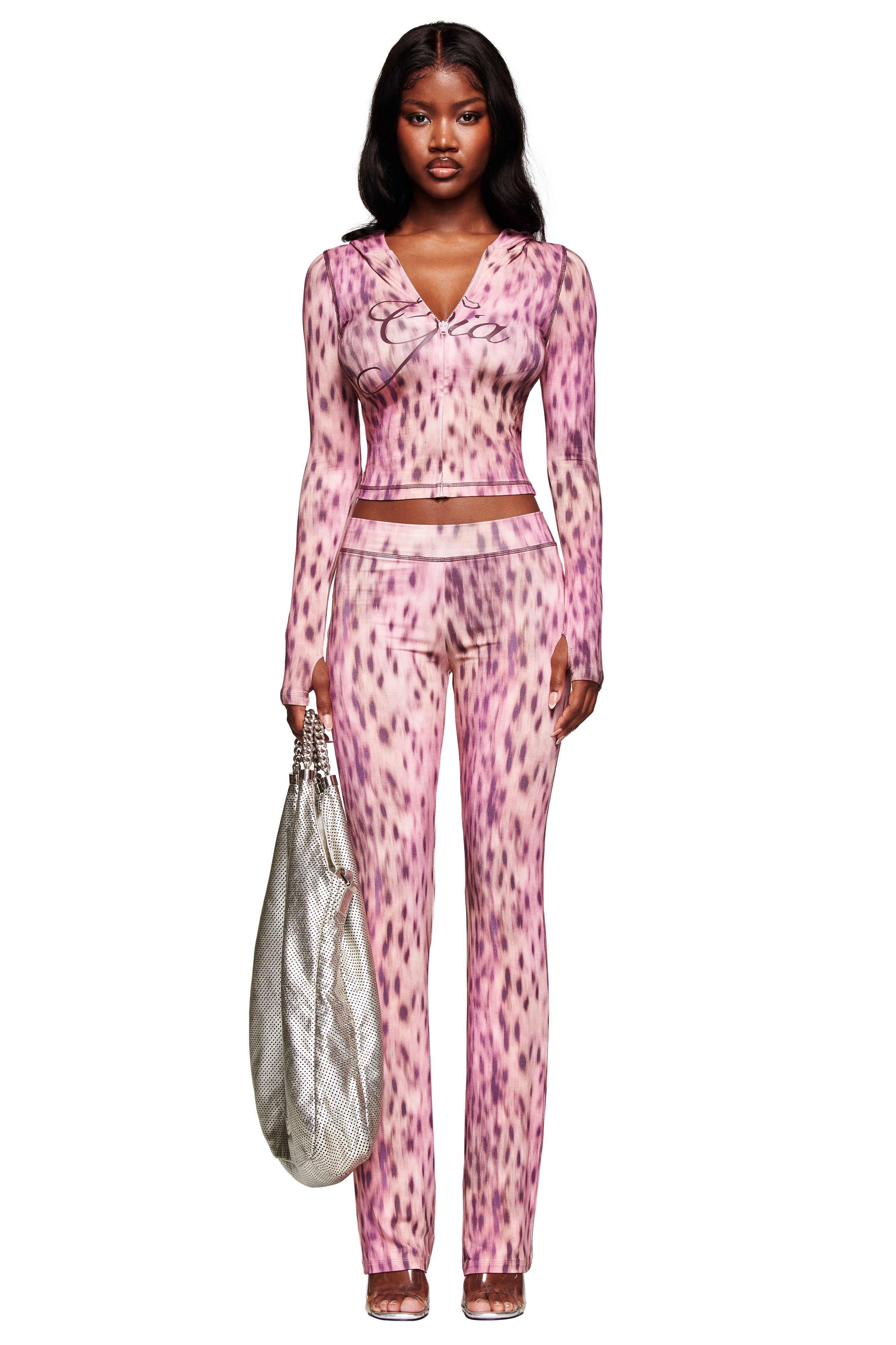 A woman wearing the I.AM.GIA BLARE HOODIE in Pink Blurred Cheetah.