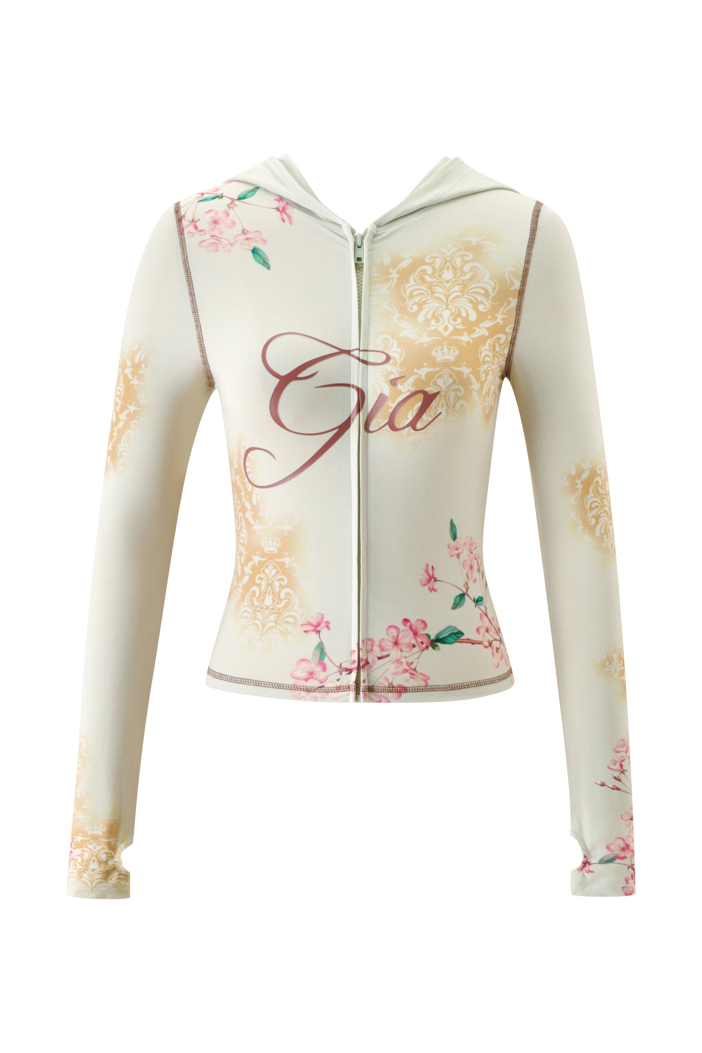 The BLARE HOODIE - BLOSSOM by I.AM.GIA is a cream zip-up hoodie with “Gia” printed on the front, showcasing a pink and gold blossom print with a damask pattern.
