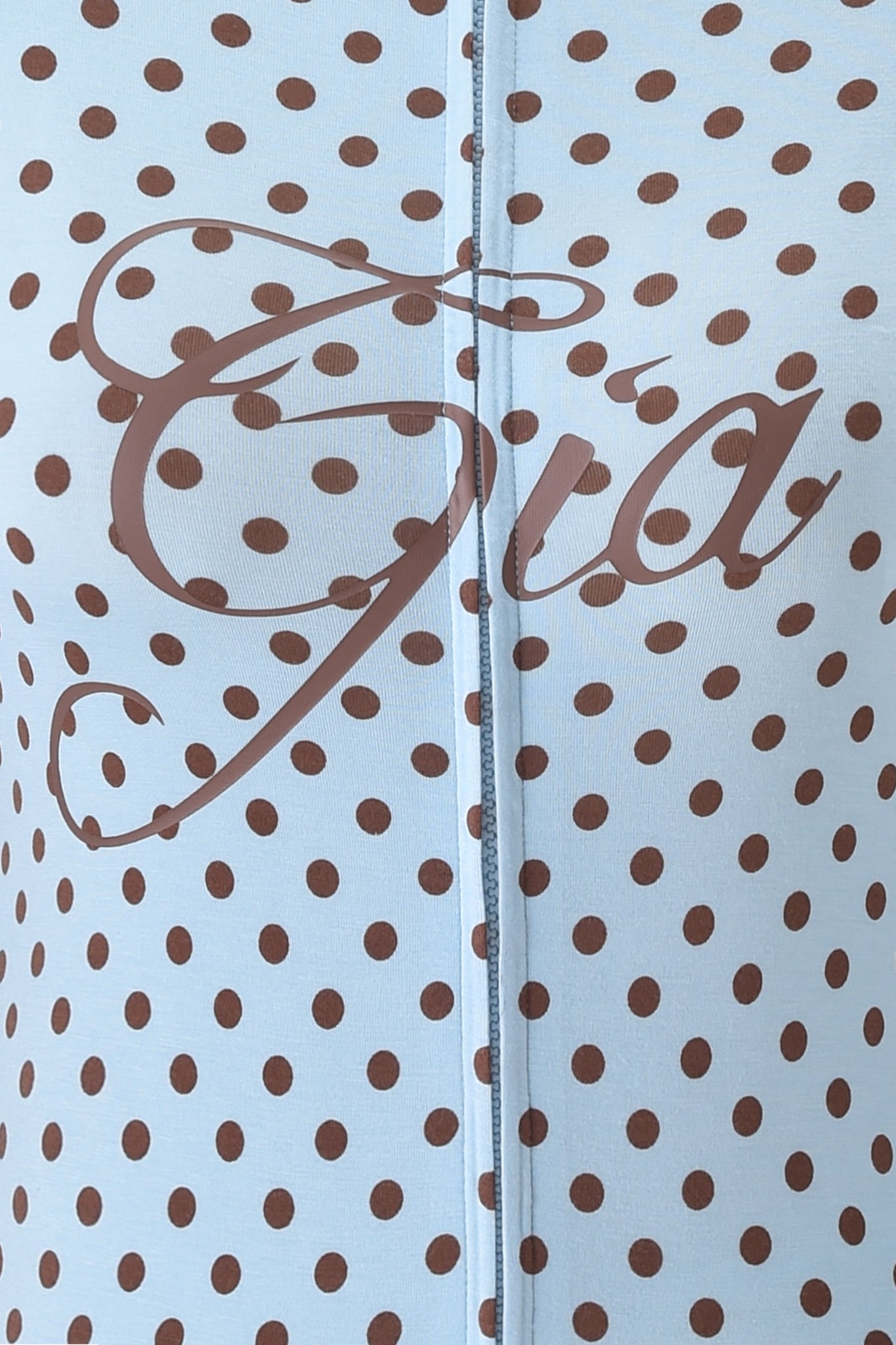 The I.AM.GIA BLARE HOODIE - BLUE POLKA DOT features soft bamboo fabric in light blue with brown polka dots, a chic vertical seam, and "Gia" elegantly scripted in brown across the center.
