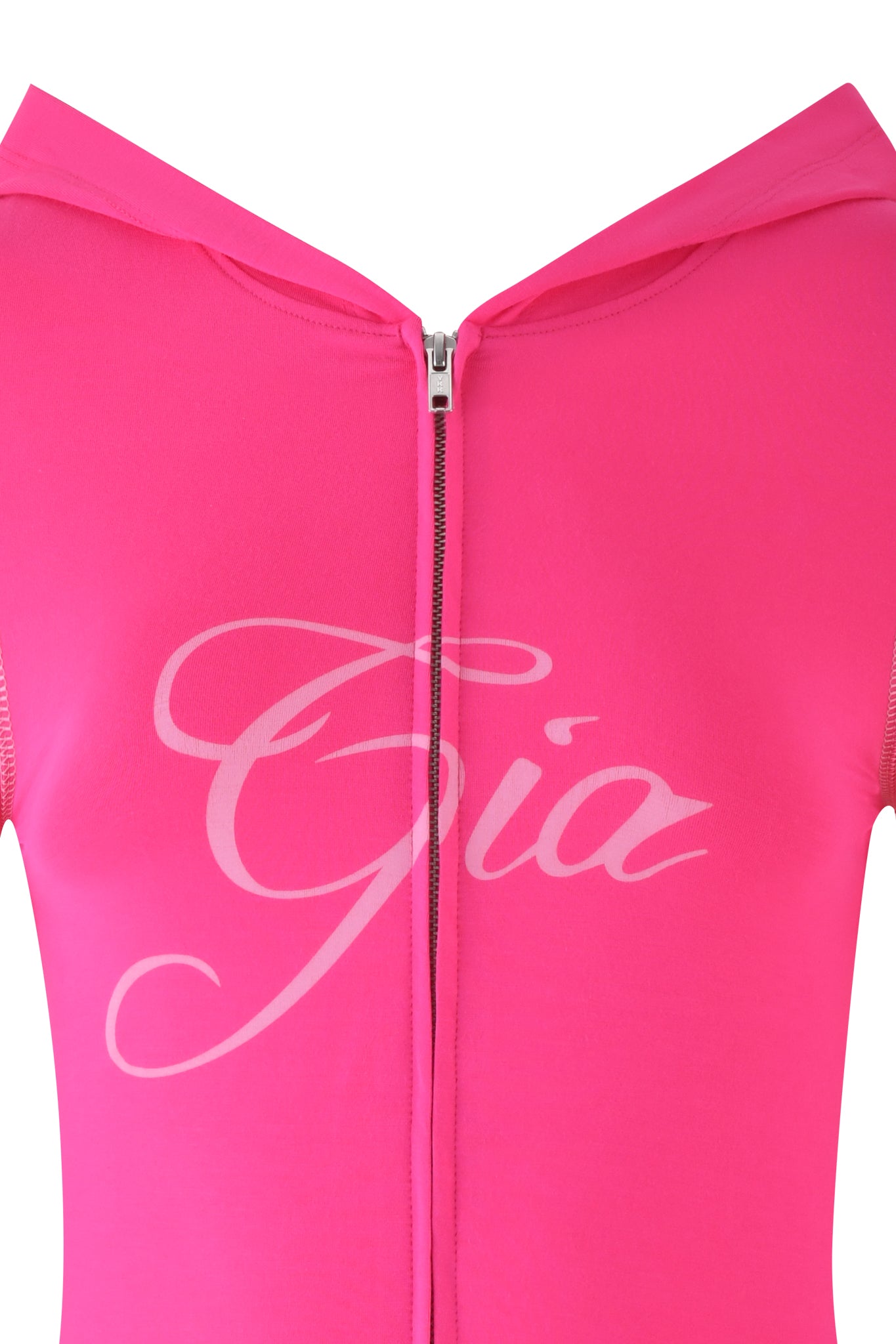 A close-up of the BLARE HOODIE - PINK by I.AM.GIA features "Gia" in white cursive on a bubblegum pink garment. This hot pink hoodie has a bodycon fit with a front zipper extending to the top.