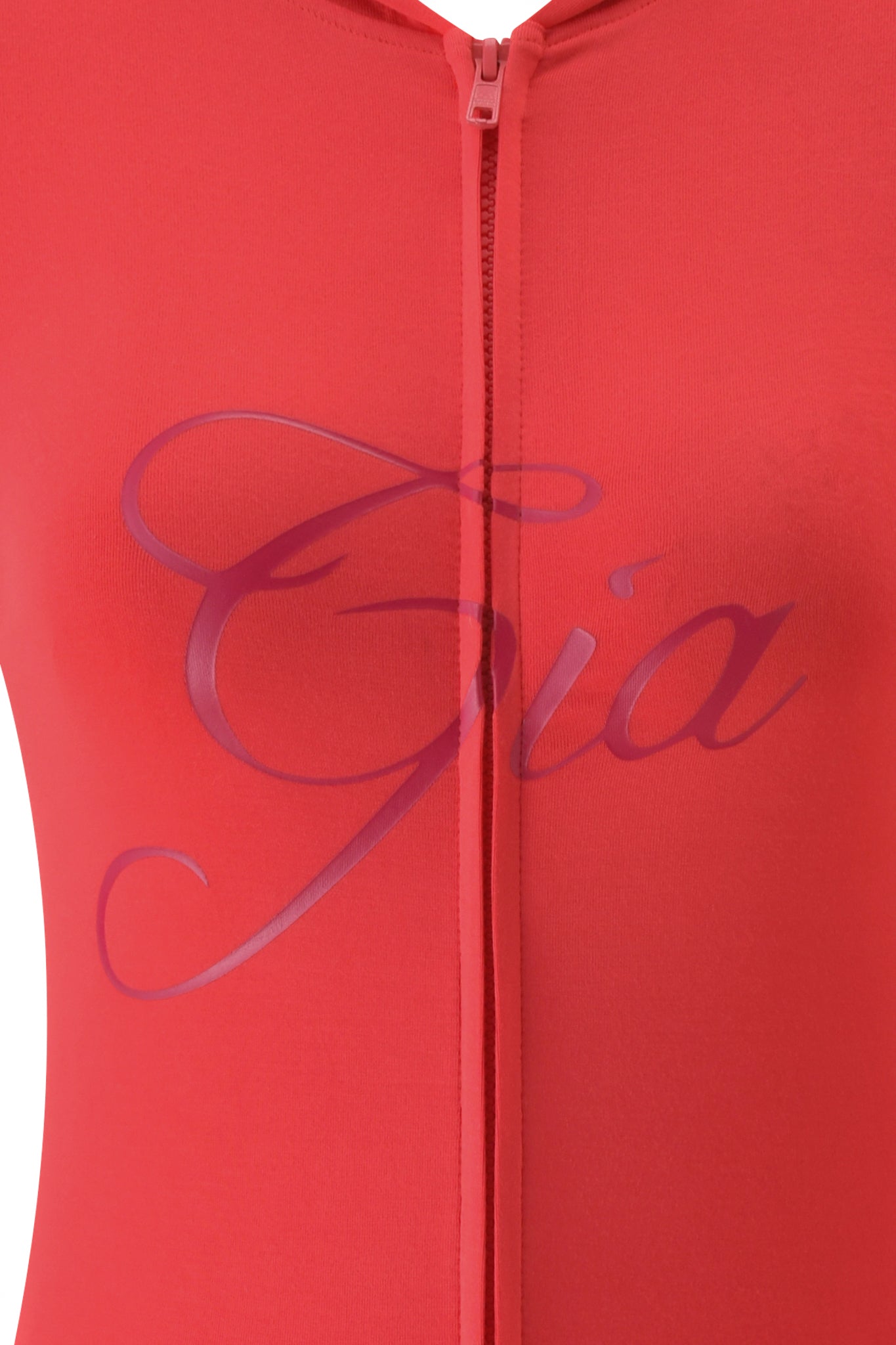 Close-up of the I.AM.GIA BLARE HOODIE in Papaya, featuring a front zipper and "Gia" elegantly scripted across the chest.