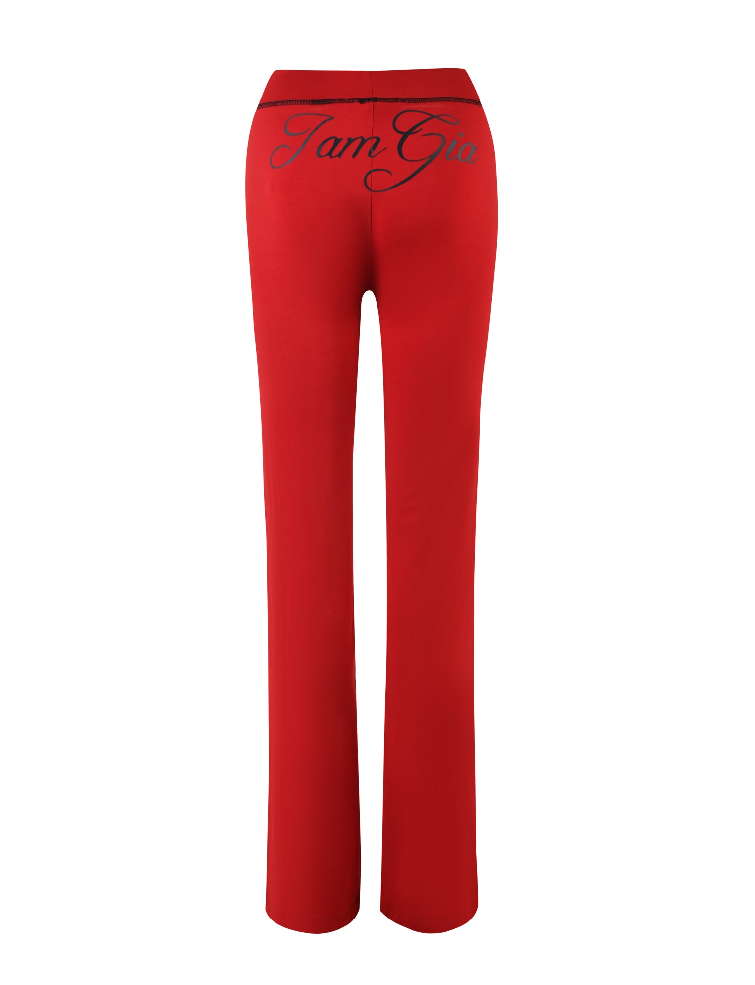 Back view of a pair of BLARE TRACKPANT - RED with cursive "I.AM.GIA" printed on the waistband. These bootcut pants, crafted from stretchy bamboo fabric, feature a sleek, bodycon silhouette.