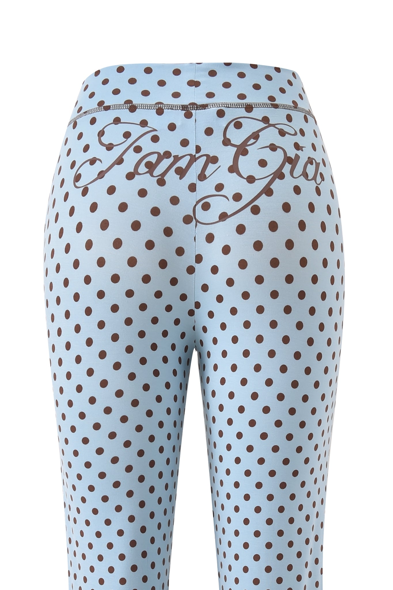 I.AM.GIA’s BLARE TRACKPANT - BLUE POLKA DOT features a light blue color with brown polka dots and "Tom Girl" in cursive on the back waistband, shown here in a low rise flared fit from the back view.