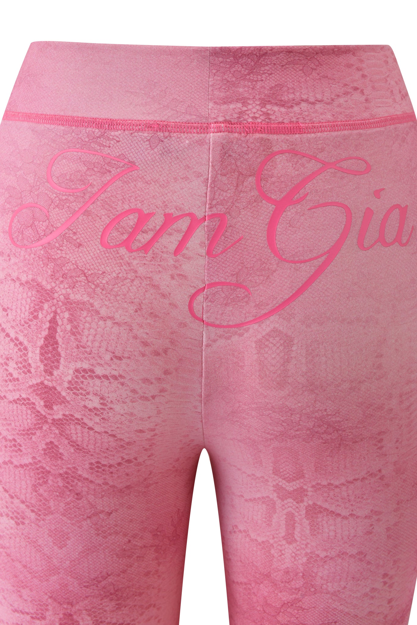 The BLARE TRACKPANT - LIGHT PINK SERPENTINE by I.AM.GIA showcases a striking serpentine print, “I.AM.GIA” cursive on the back waistband, and trendy flared legs.