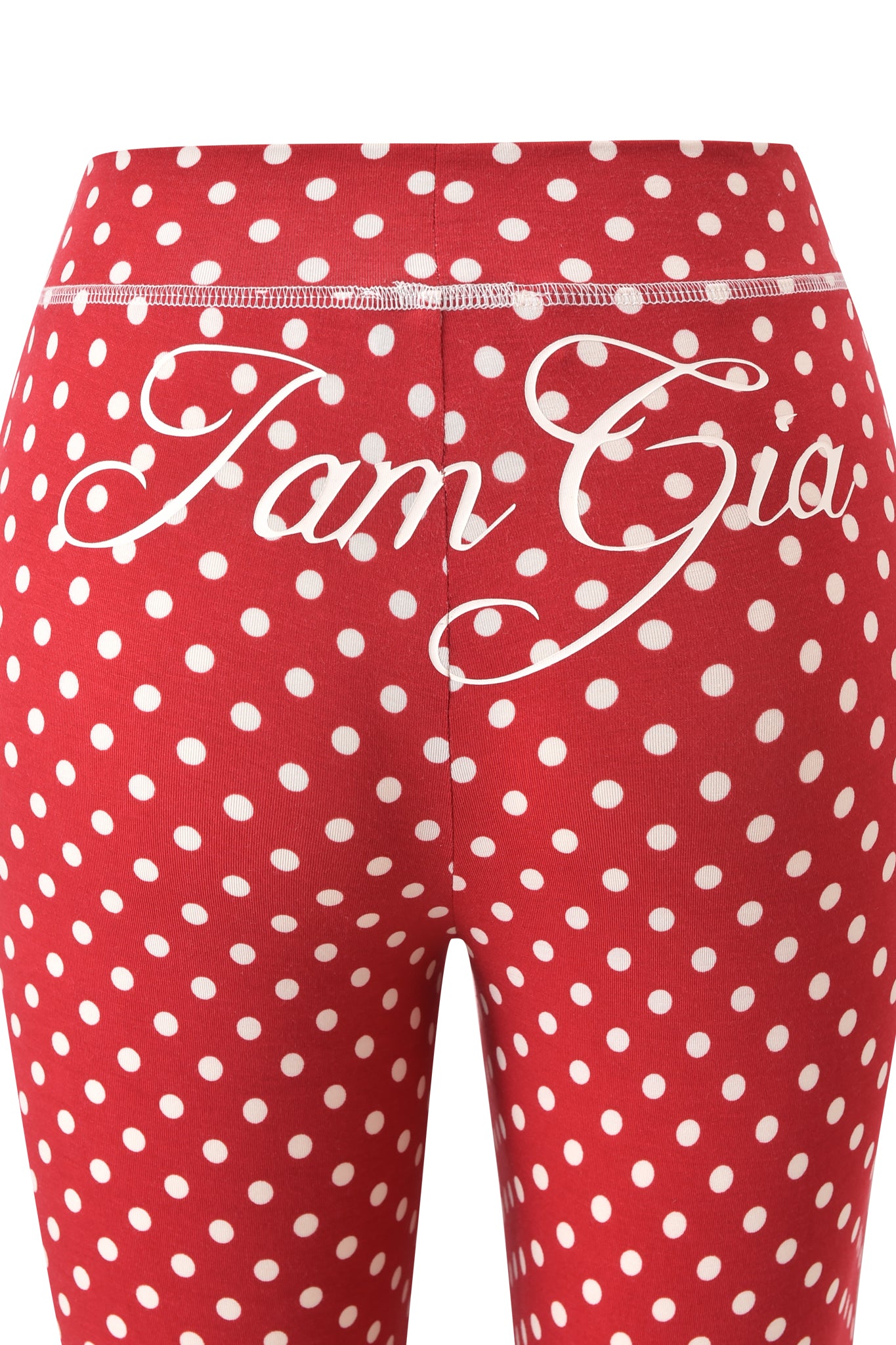 The BLARE TRACKPANT - RED POLKA DOT by I.AM.GIA features white polka dots and "I.AM.GIA" in white cursive across the back waistband.