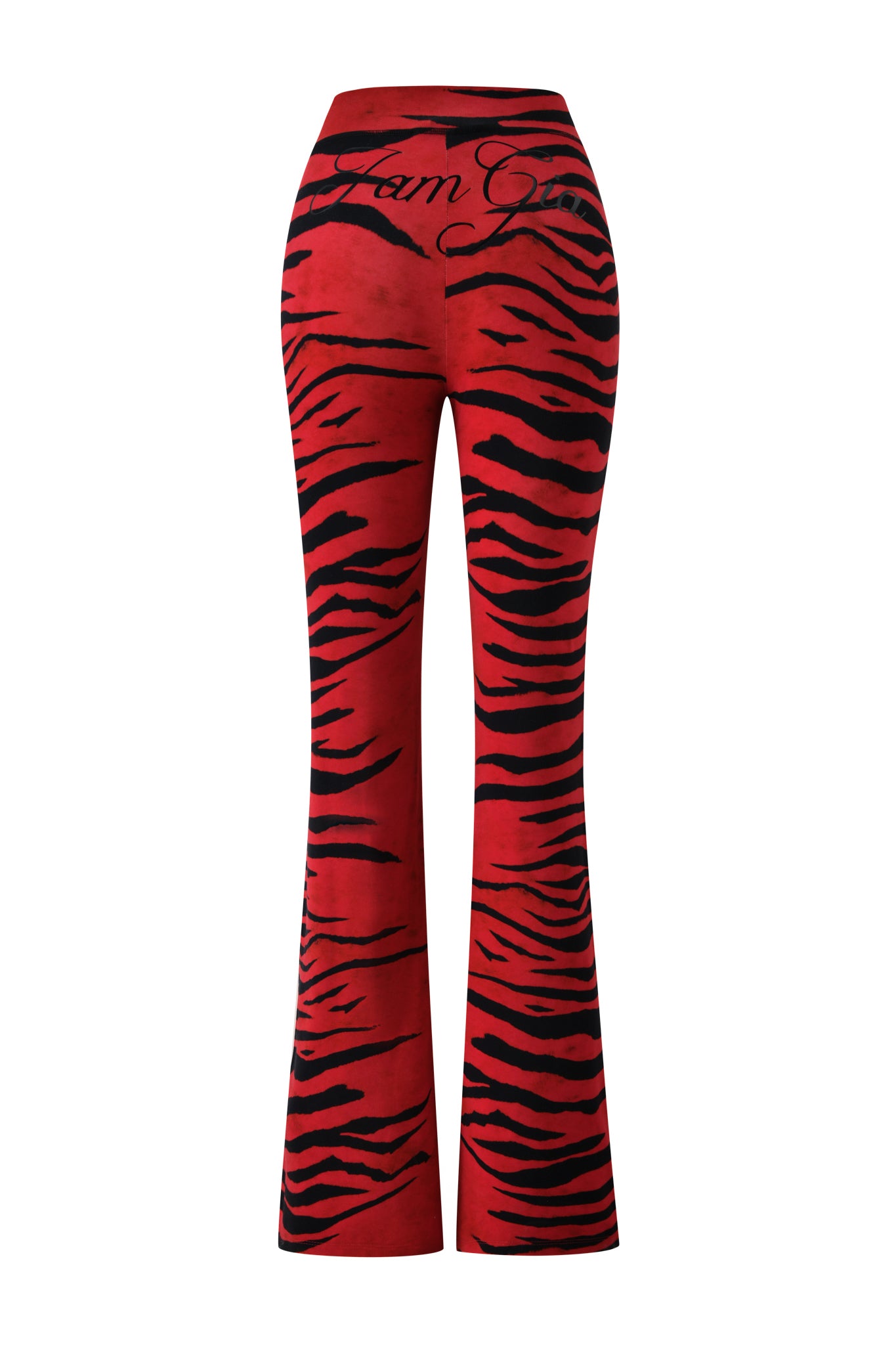The BLARE TRACKPANT - RED WILD SIDE by I.AM.GIA features high-waisted, vibrant red trackpants with dramatic black tiger stripes reminiscent of a zebra print and “I am Gia” scripted across the back waistband, displayed from the rear on a white background. These striking trackpants make a bold, fierce statement to any outfit.