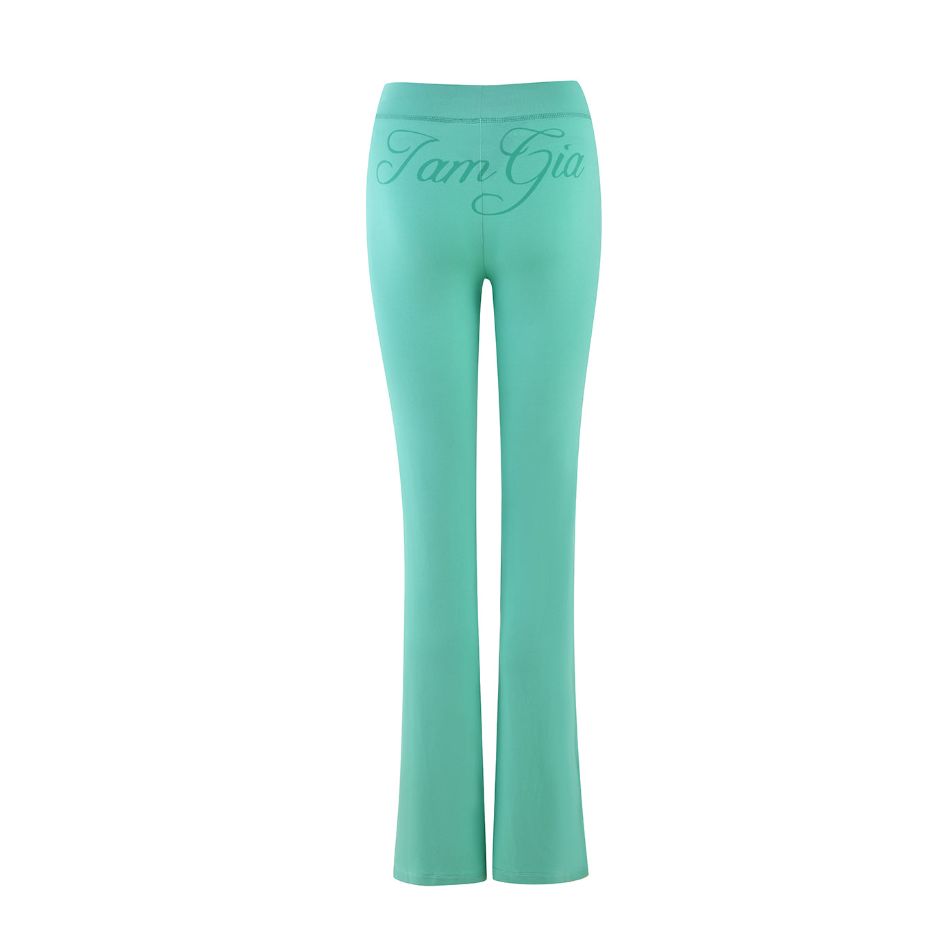 The BLARE TRACKPANT in turquoise teal from I.AM.GIA features a flared design crafted from stretchy bamboo fabric, with "Tam Gio" on the back waistband, embodying chic comfort.