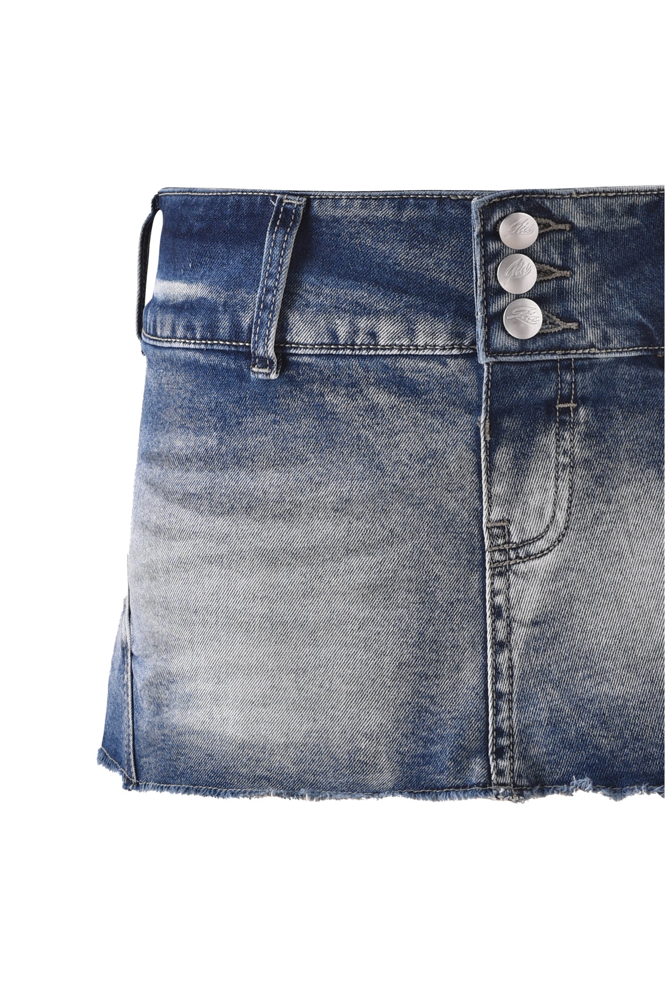 Close-up of the I.AM.GIA NYKKO SKORT - ICE BLUE, a blue denim micro mini skirt featuring three metal buttons, front pocket, belt loop, frayed hem, and faded texture. The low-rise skirt is partially cropped against a white background.