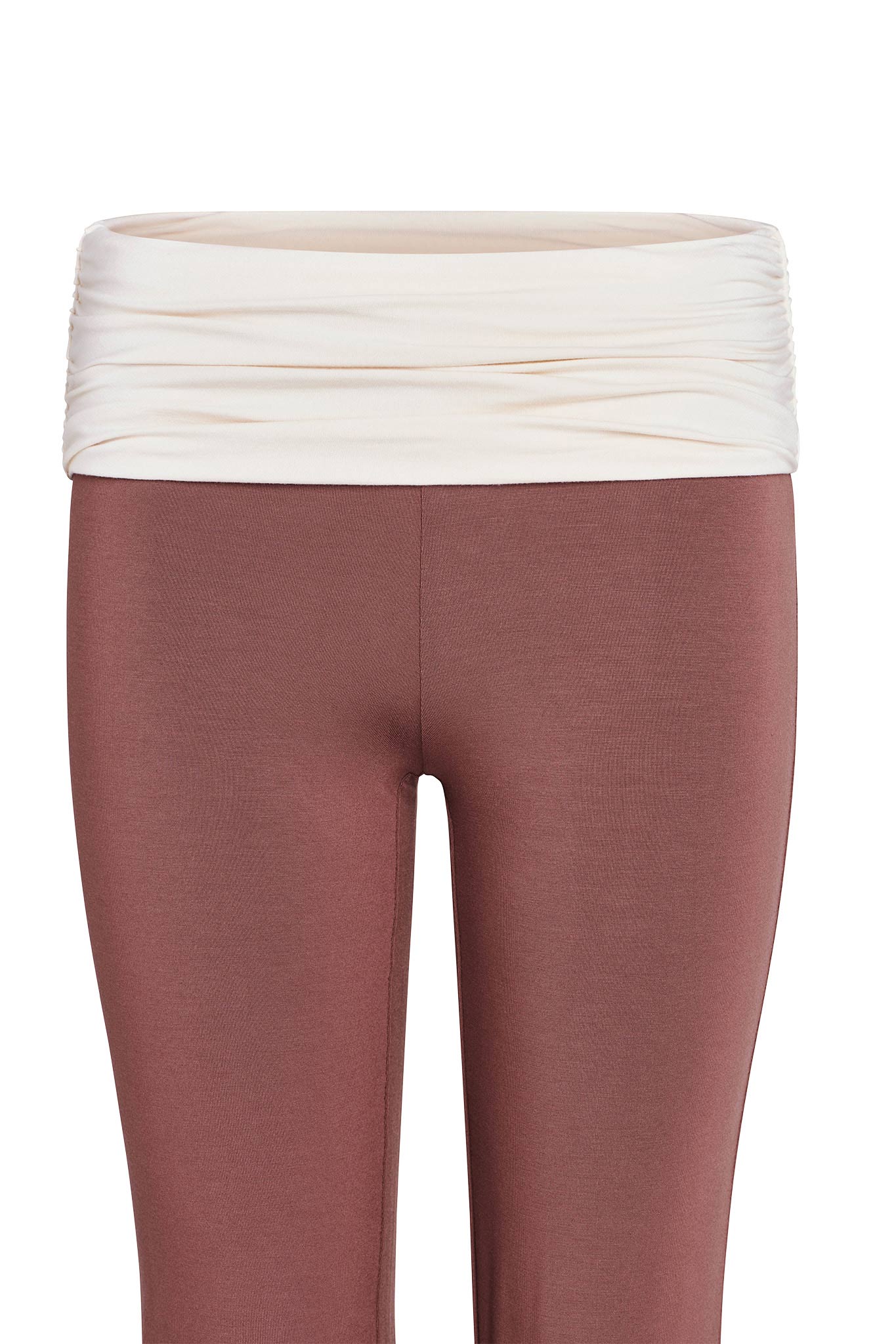 Introducing the JANNIS PANT - BROWN : CHOCOLATE by I.AM.GIA, a pair of fashion-forward leggings featuring a high-waisted beige ruched waistband and a chic chocolate brown body. With flared legs for added style, these leggings are crafted from eco-friendly bamboo fabric, ensuring both comfort and sophistication. Presented against a plain white backdrop.