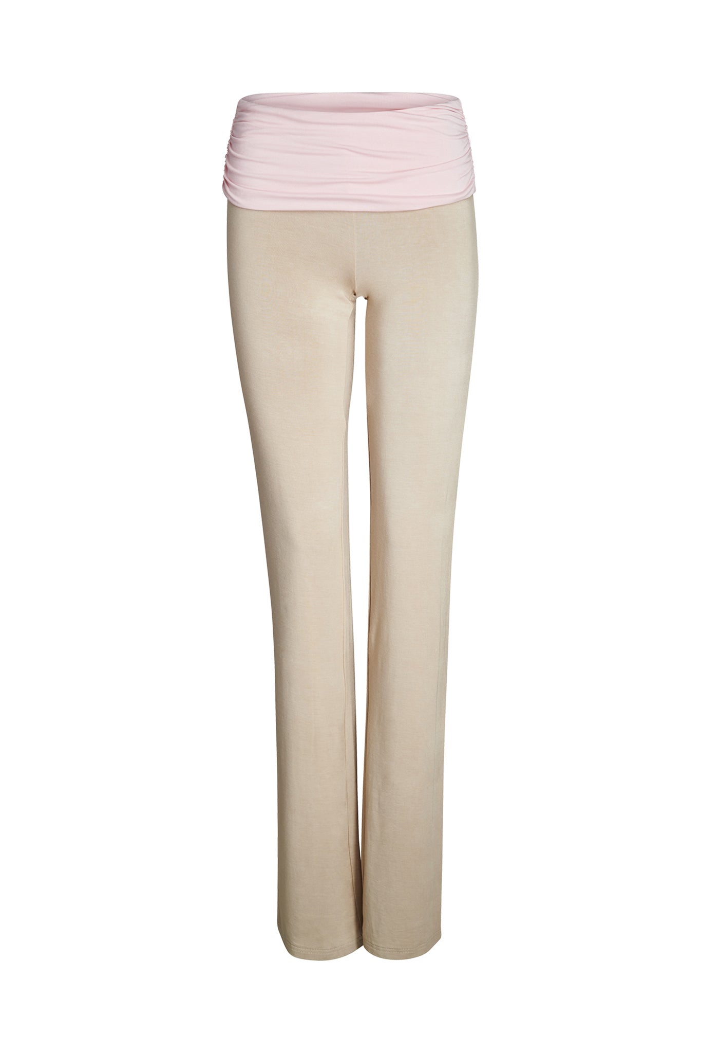 A pair of JANNIS PANT - NEUTRAL : TAN/PINK from I.AM.GIA, featuring a wide, light pink fold-over waistband. The tan fabric appears soft and stretchy, suitable for casual or active wear. The image is isolated on a white background.