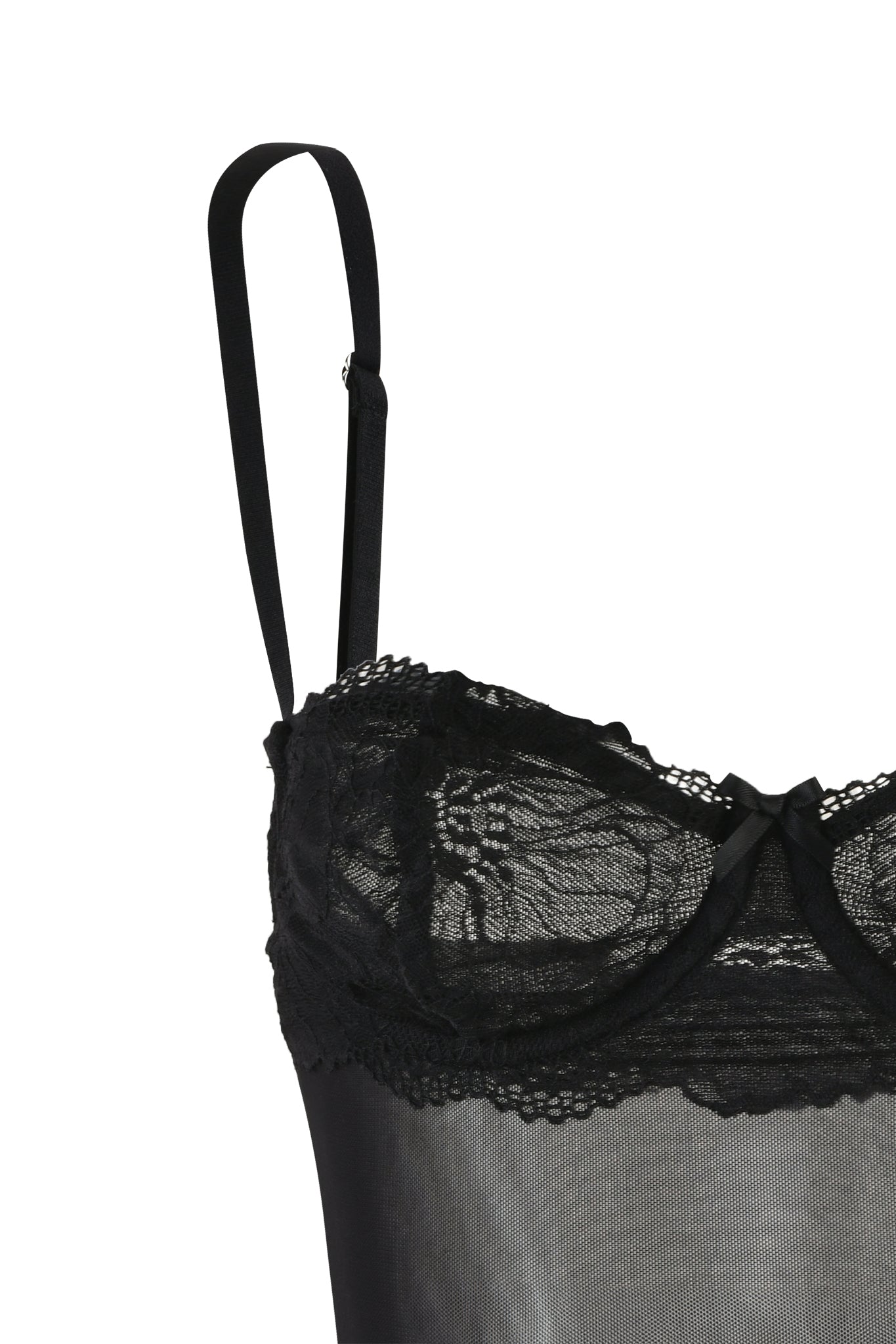 Close-up of the SILO TOP - BLACK by I.AM.GIA featuring thin adjustable straps. The top showcases intricate lace detailing on the cups and a small ribbon bow at the center, with sheer fabric below the lace adding to its allure.
