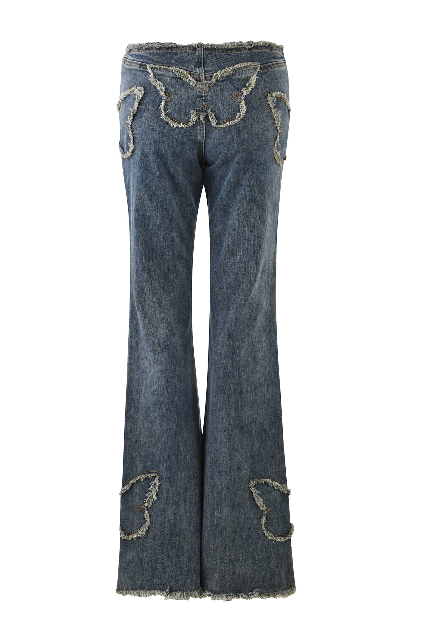 The SAFFIYAH PANT - BLUE in denim blue by I.AM.GIA, viewed from the back, features a low-rise waist and frayed butterfly-shaped cutouts on the pockets and lower legs. Made from stretch denim, these flare jeans have a unique distressed look with slightly worn fabric that enhances their vintage style.
