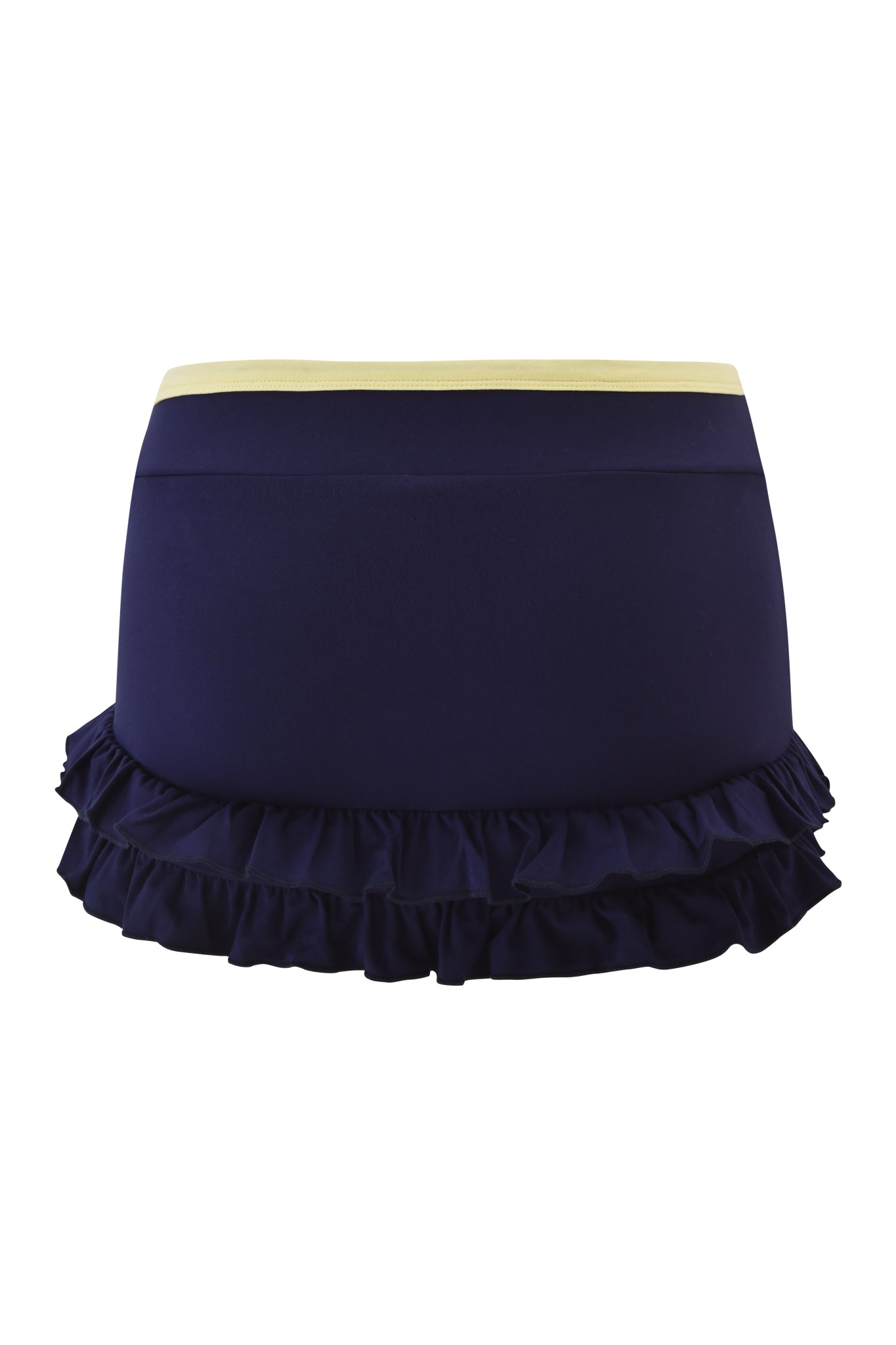 The MICHELLE SKORT - NAVY by I.AM.GIA features a navy blue low-rise mini design, pale yellow waistband, and layered ruffle hem, shown on a plain white background.