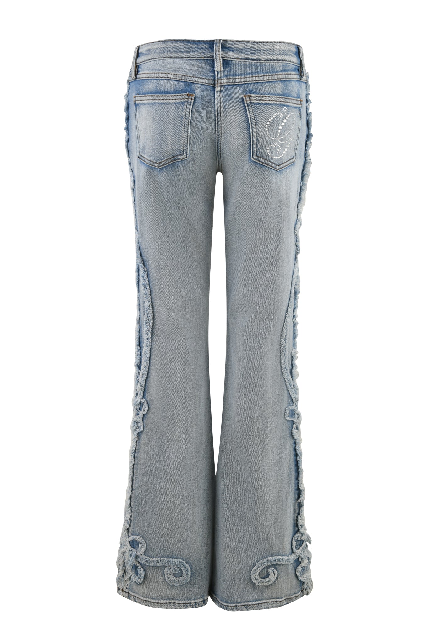 Back view of the TYLA JEAN - BLUE : DENIM BLUE from I.AM.GIA. These light blue flared jeans feature intricate distressed detailing, frayed edges along the outer seams, and embroidered patterns near the bottom. They also include two back pockets with a small embroidered design on one pocket.