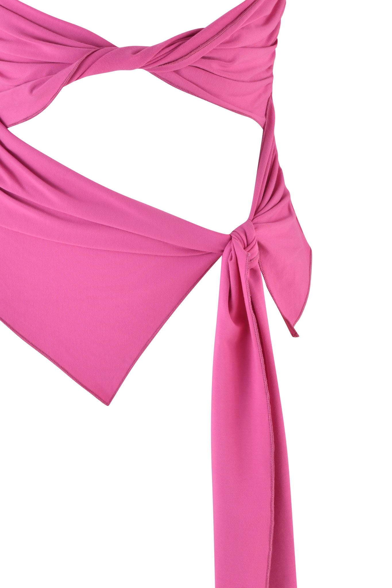 Close-up of the I.AM.GIA KEHLANI TOP in Neon Pink, with its twisted and knotted draped fabric. The image focuses on the intricate folds and cutout details, highlighting the texture and elegance of the material. The white background emphasizes the vivid color and distinctive design features.