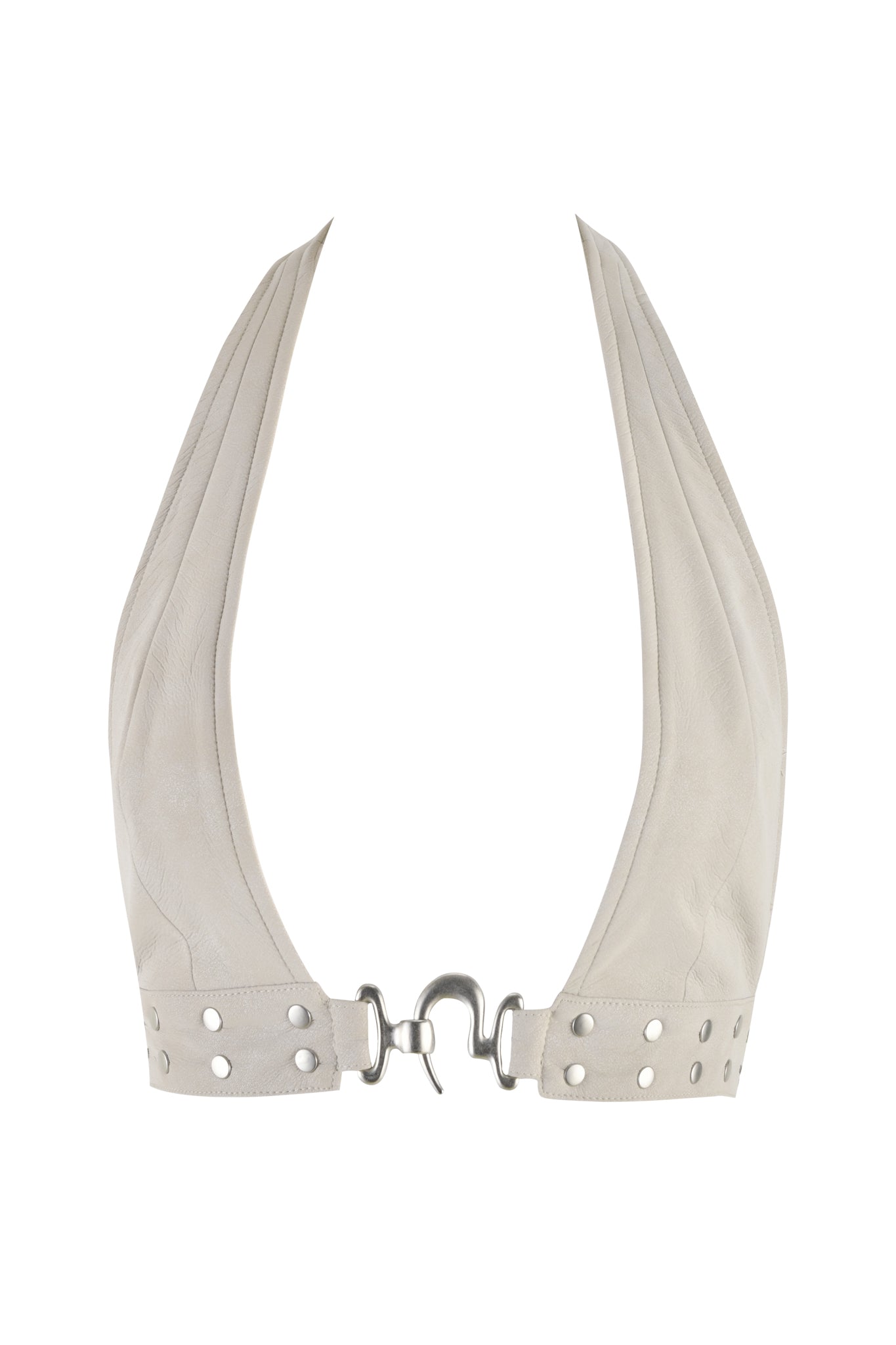 The DOLLY TOP - NEUTRAL : TAN by I.AM.GIA is a cream faux leather halter top with wide straps that meet at the neck and flow into an open back. This bodycon design features silver metal hook-and-eye closures and is embellished with silver rivets near the bottom hem for an edgy touch.