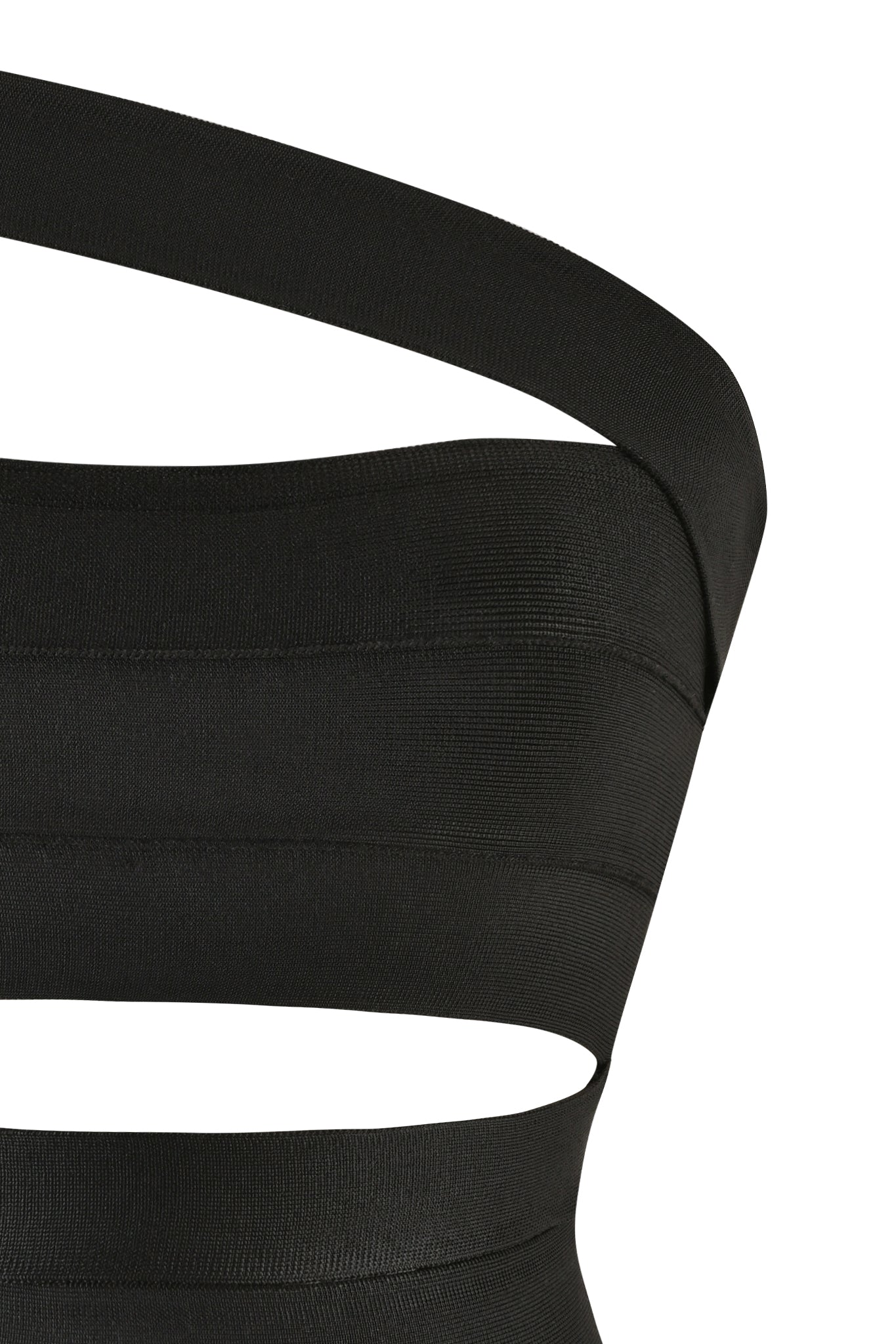 Close-up of the FLAVIA TOP - BLACK by I.AM.GIA, featuring a one-shoulder design with multiple cut-outs along the bodice. The mid-stretch fabric is enhanced with horizontal ribbed detailing, creating a sleek and modern silhouette. A subtle gunmetal zipper adds an edgy finish.