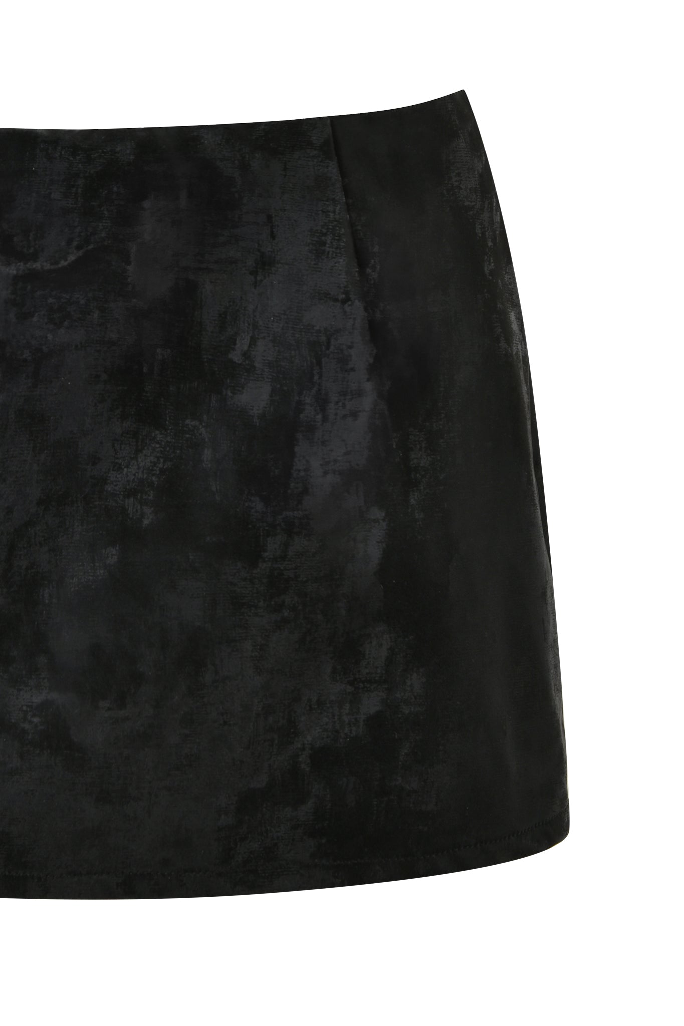The FRANCINE SKORT - BLACK by I.AM.GIA is a sophisticated black velvet mini skirt with a simple, straight cut design. Featuring subtle texture variations and a slight sheen for a luxurious appearance, this bodycon skort offers versatility with no visible embellishments, making it suitable for various occasions.