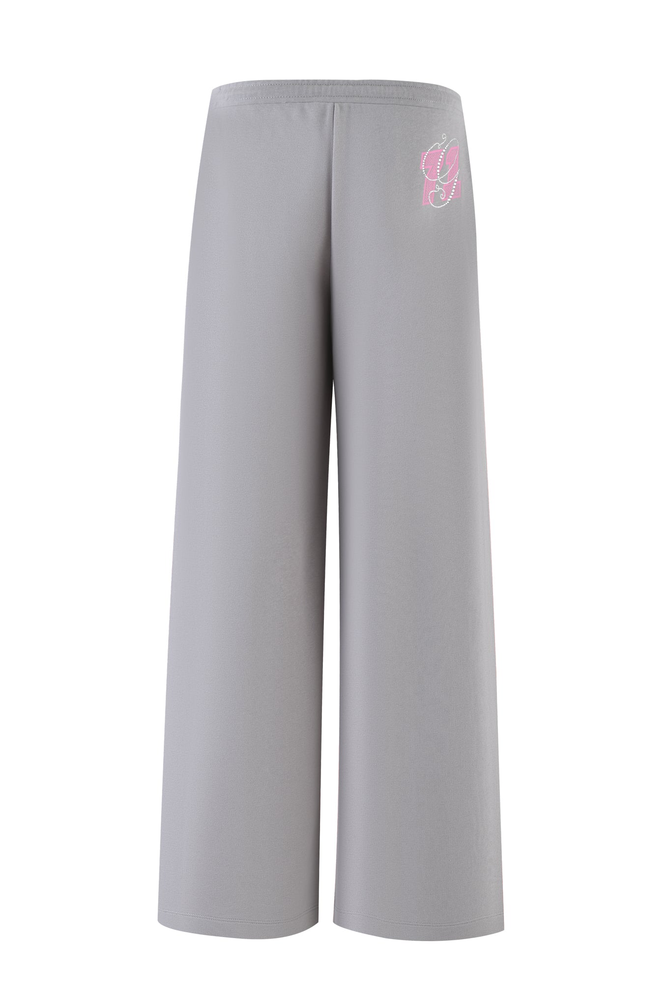 The ARLO TRACK PANT - GREY : PINK by I.AM.GIA features gray wide-leg track pants with a smooth, stretchy material, low-rise elastic waistband, and pink/white logo on the upper left side for comfort and style.