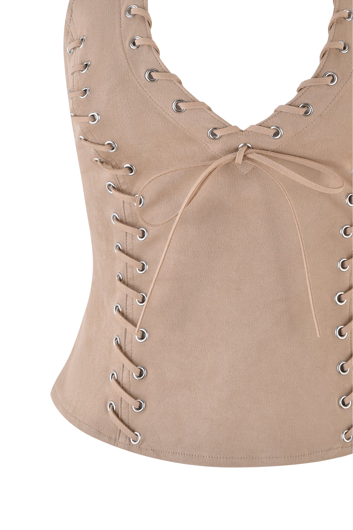 The ZEPHYR TOP - BEIGE : TAN by I.AM.GIA is a tan faux suede, sleeveless corset with a V-neck. It features metal eyelets and beige laces crisscrossing the front, offering a bodycon fit for an edgy fashion statement.
