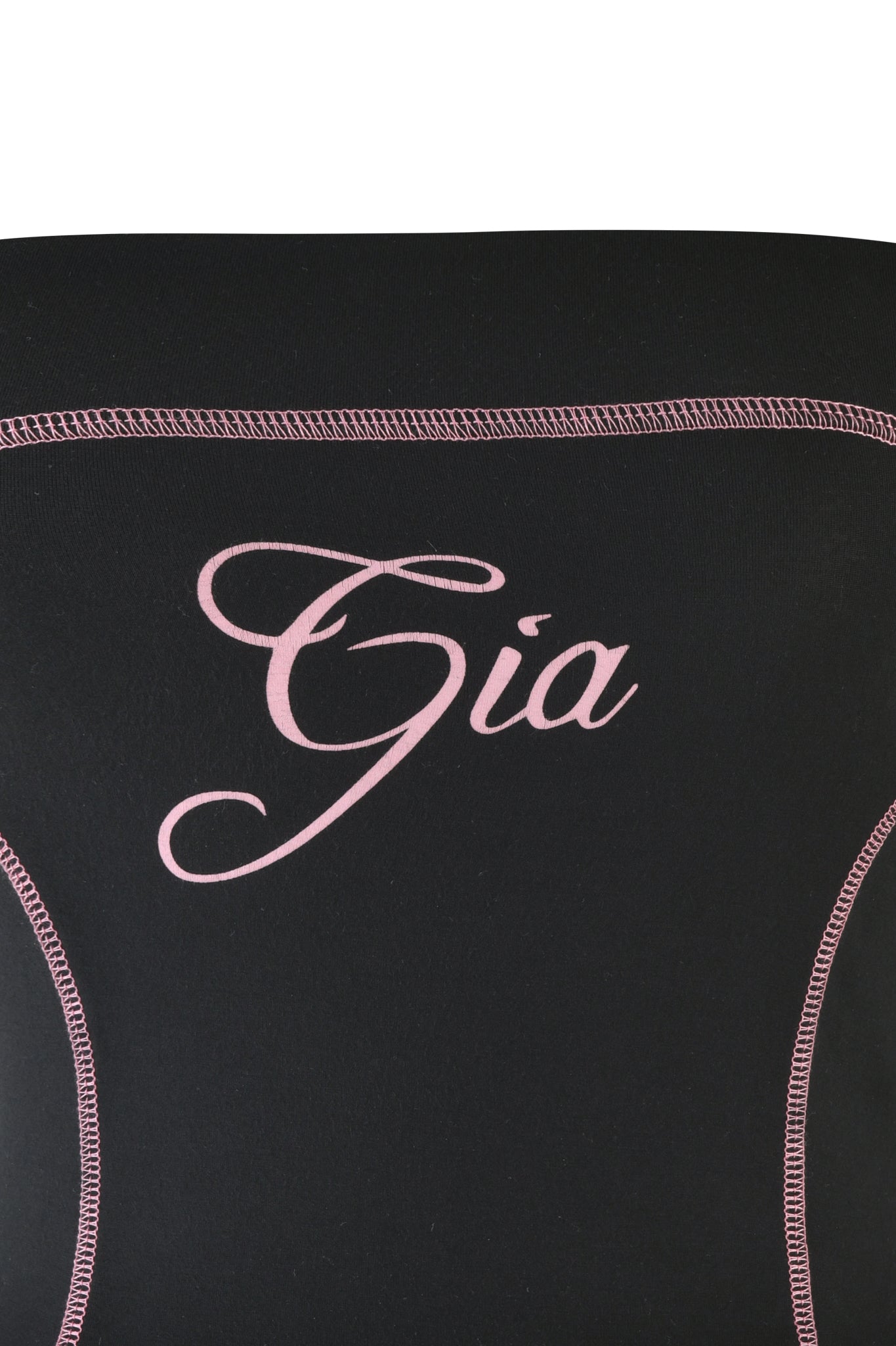 Close-up of the BLARE BOOB TUBE - BLACK from I.AM.GIA featuring pink curved stitching and the name "Gia" elegantly scripted in pink, adding sporty princess seams.