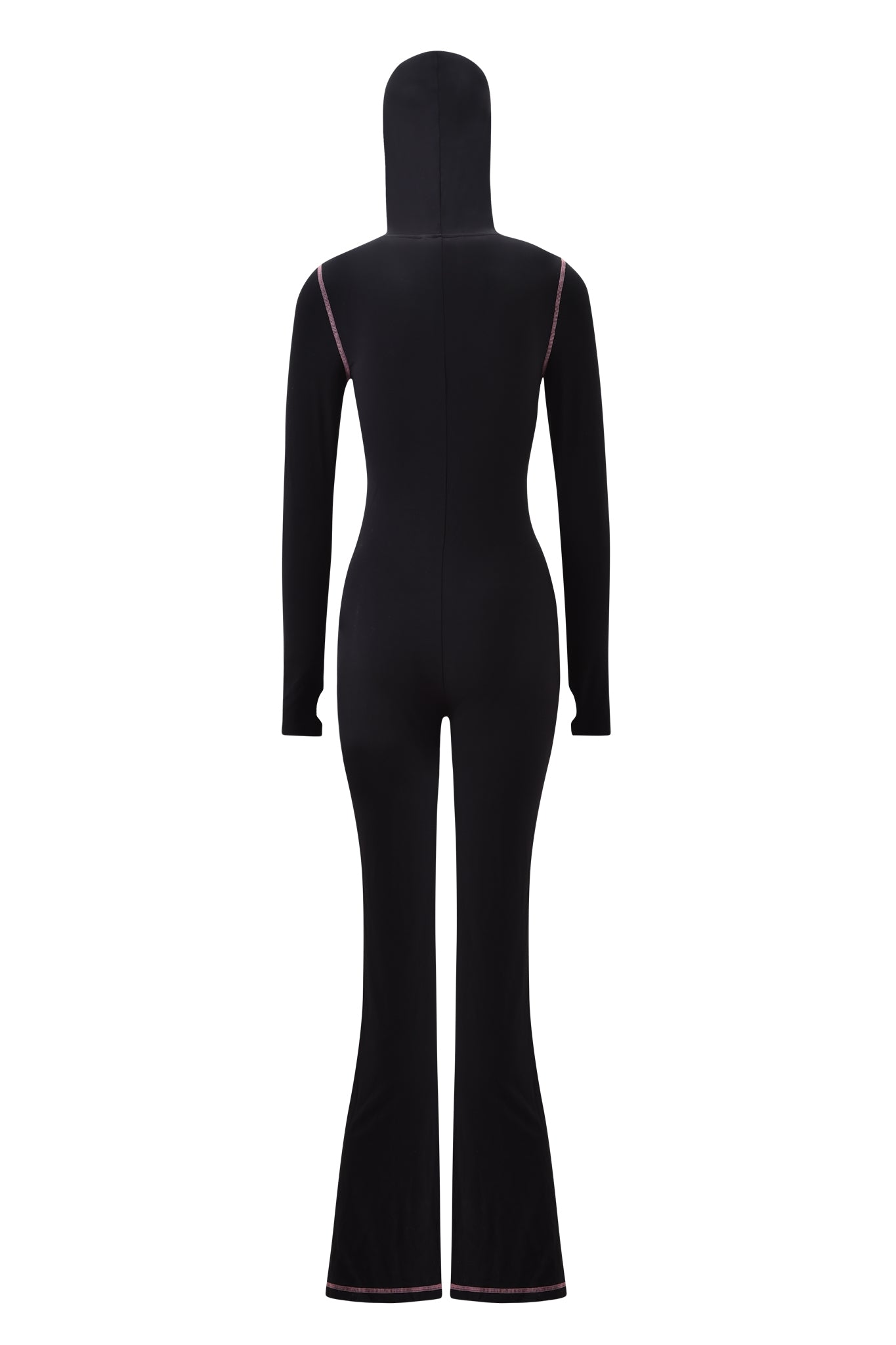 The I.AM.GIA BLARE JUMPSUIT - BLACK is a full-body, fitted jumpsuit with long sleeves, flared legs, and an attached hood. Shown from the back, it features subtle pink stitching along the shoulders and hems.
