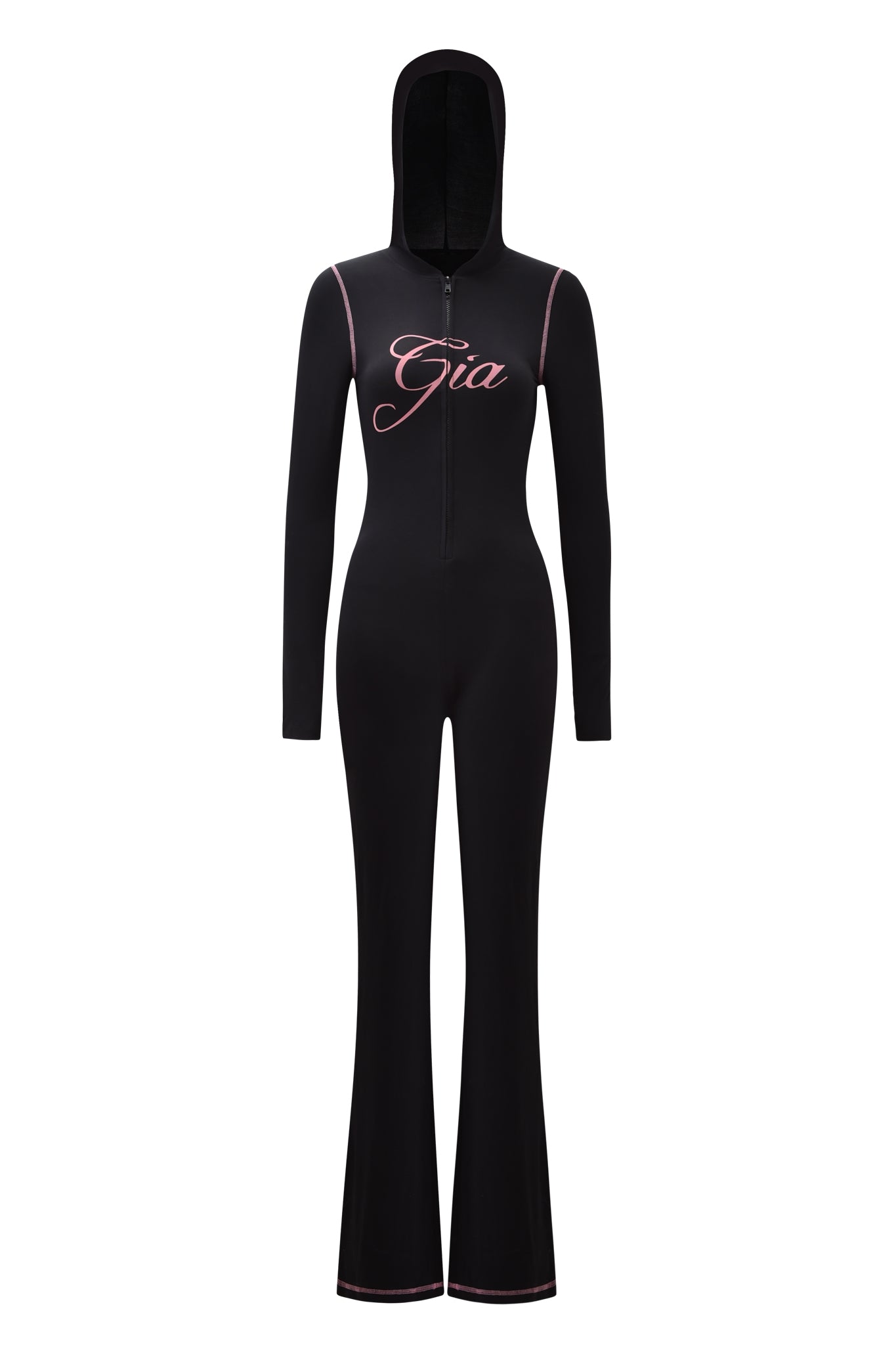 The BLARE JUMPSUIT - BLACK by I.AM.GIA features long sleeves, a front zipper, flared legs, pink "Gia" script on the chest, and pink trim on the shoulders and cuffs for a bold, stylish look.
