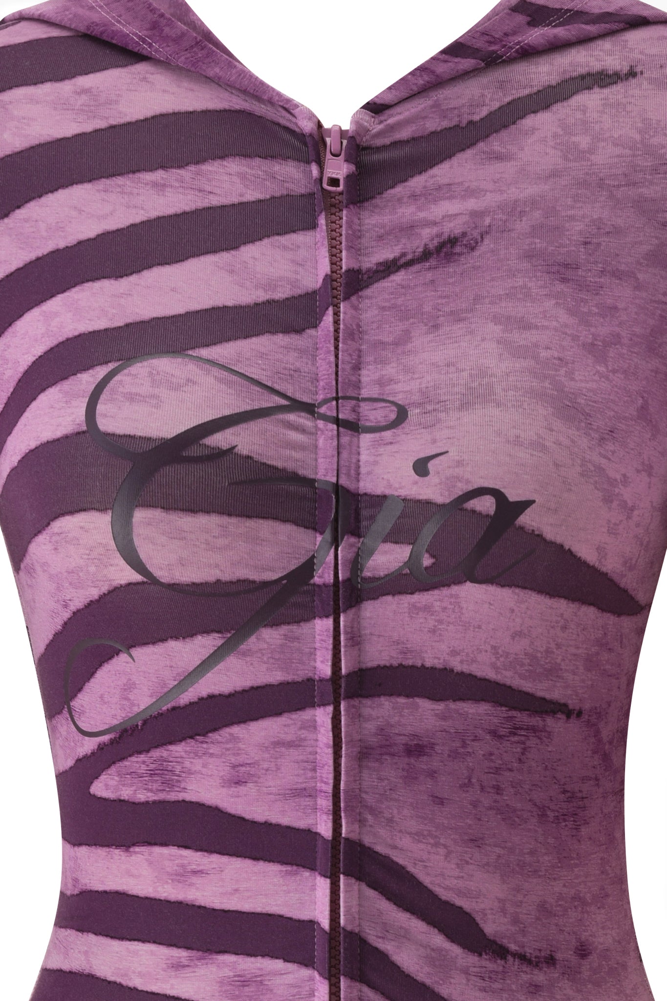Close-up of the BLARE SHORT SLEEVE ROMPER - PLUM WILD SIDE by I.AM.GIA, a bodycon mini romper with purple zebra stripes, a center zipper, and bold "GIA" script across the chest.
