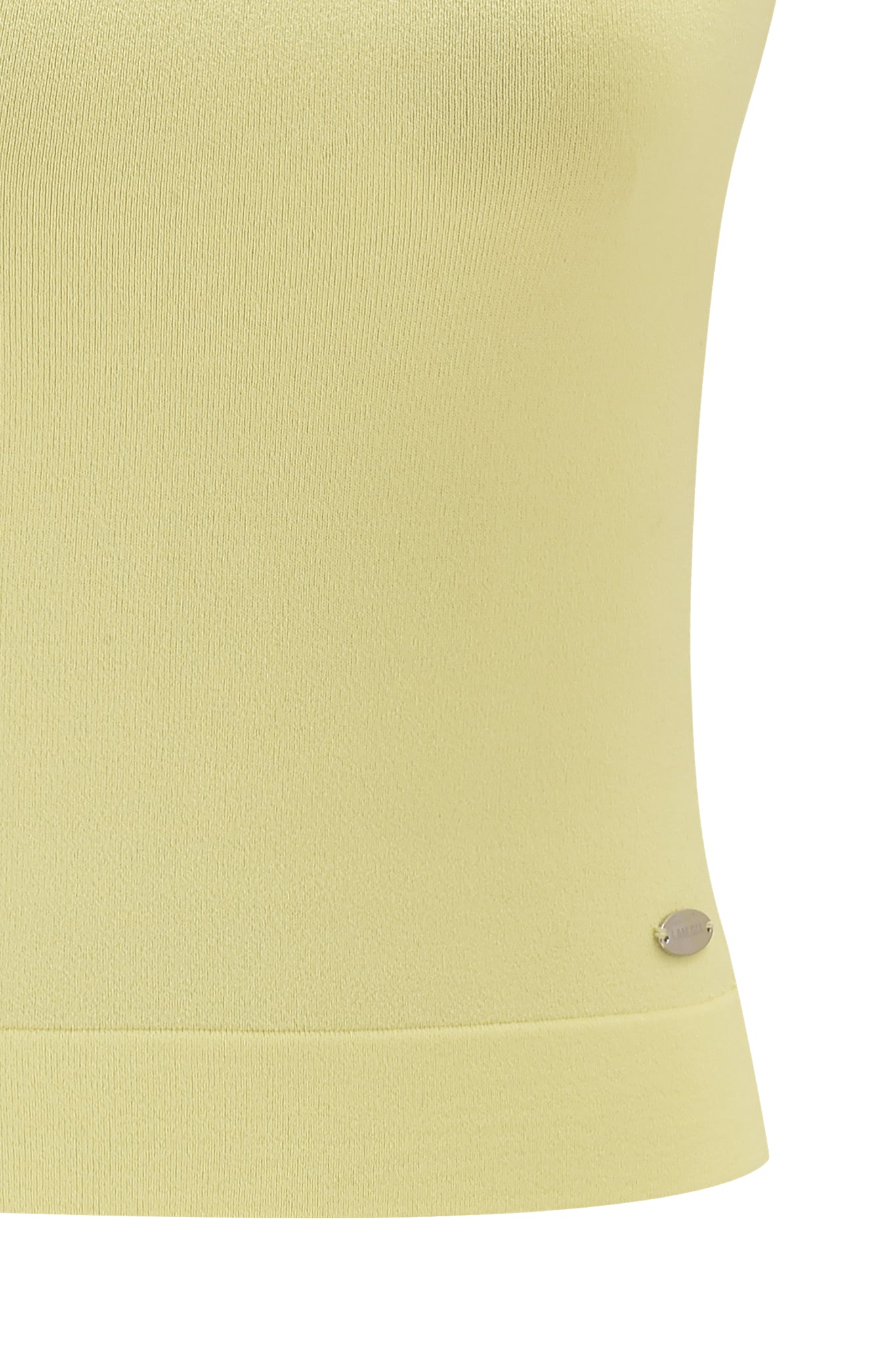 Close-up of the pale yellow, ribbed knit MORGANA 2.0 PANT by I.AM.GIA, featuring a small metallic oval tag near the bottom hem.
