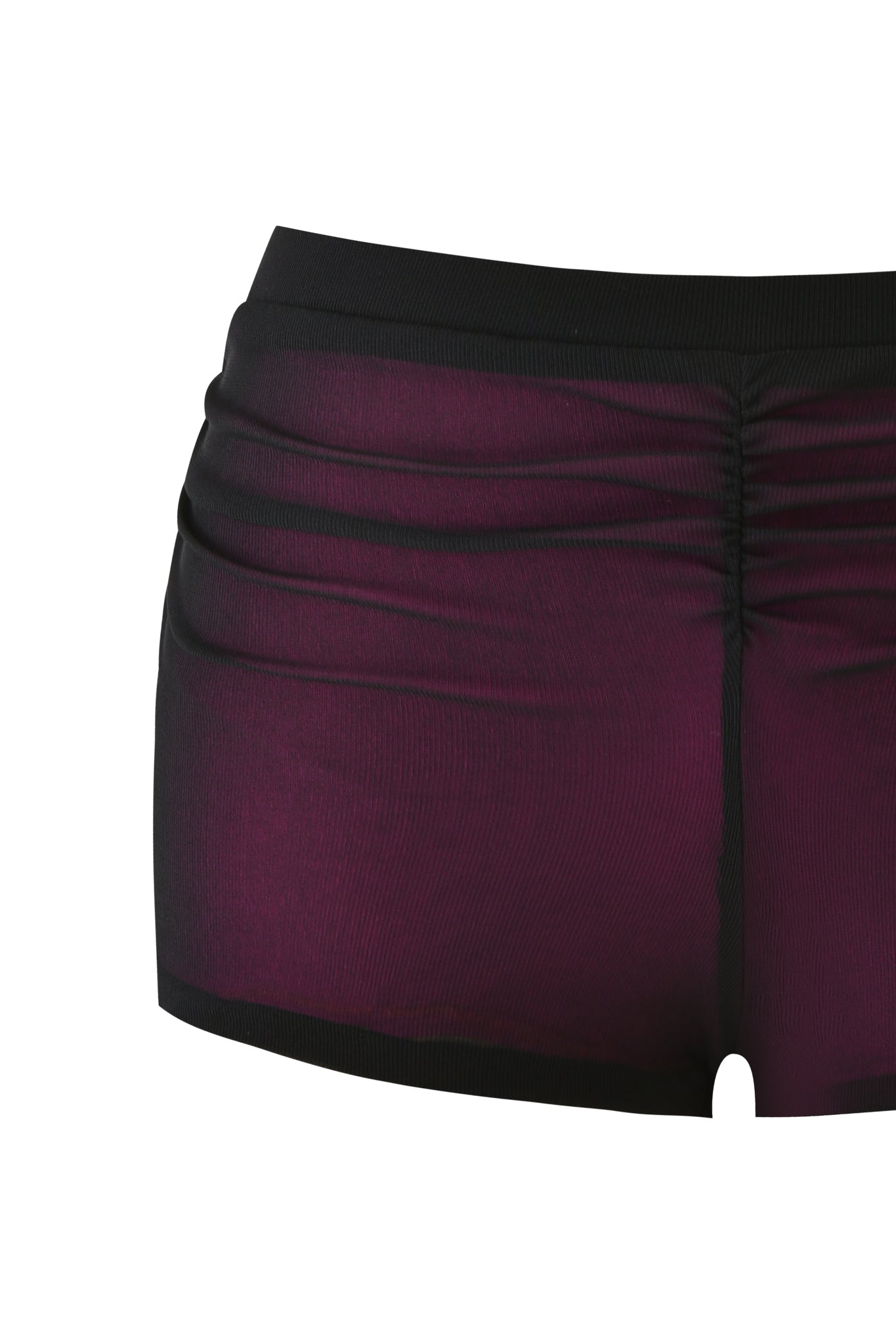A close-up of a person wearing the AVARIX HOSIERY LAYERED SHORT - PLUM by I.AM.GIA, featuring a dark purple bodycon fit, high-waisted design, black trim, and ruched sides against a white background.