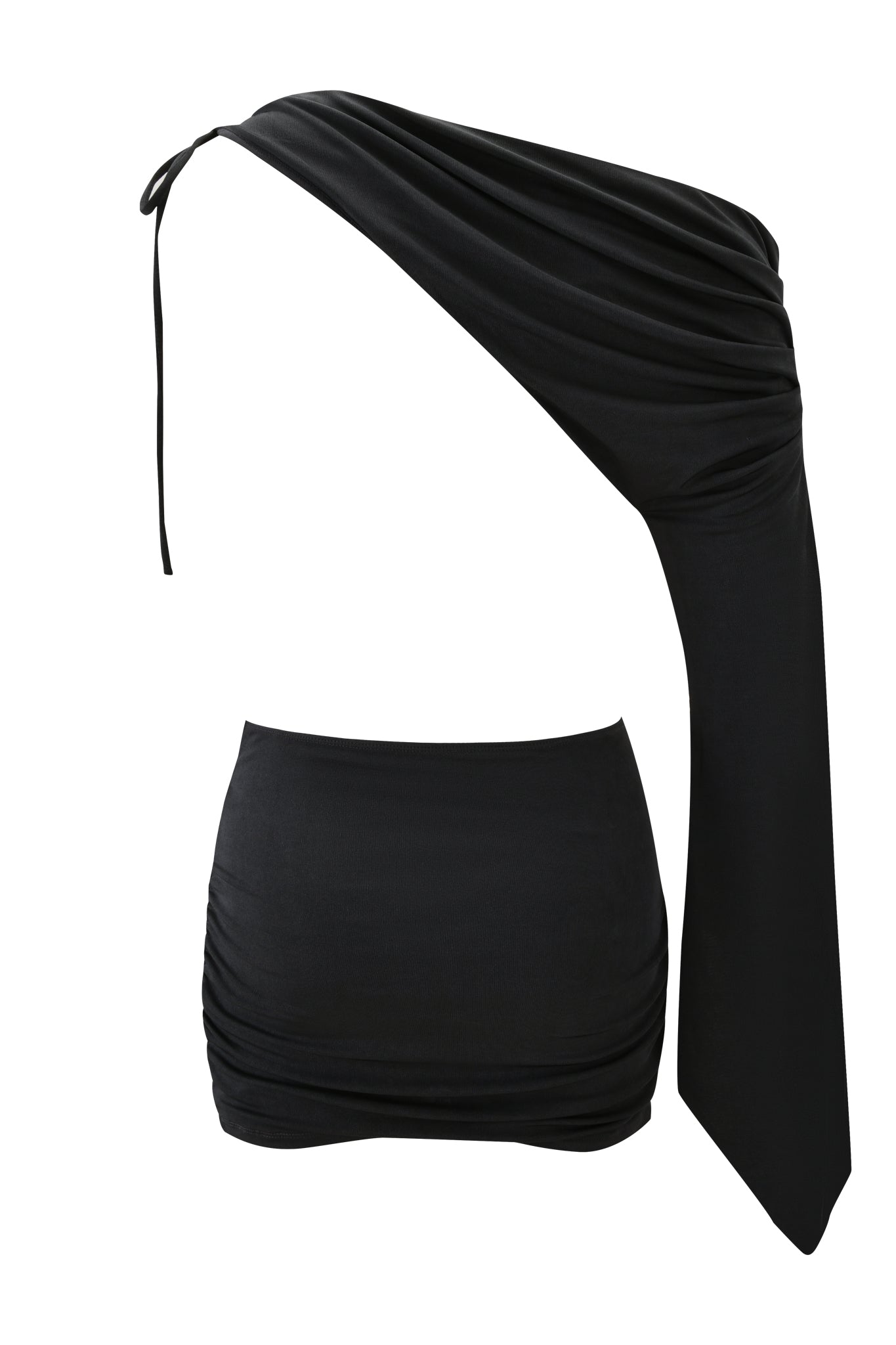 The JOLIE MINI DRESS - STEEL by I.AM.GIA is a black, asymmetrical two-piece set with a draped one-shoulder tie top and a fitted, ruched mini skirt, shown against a white background.