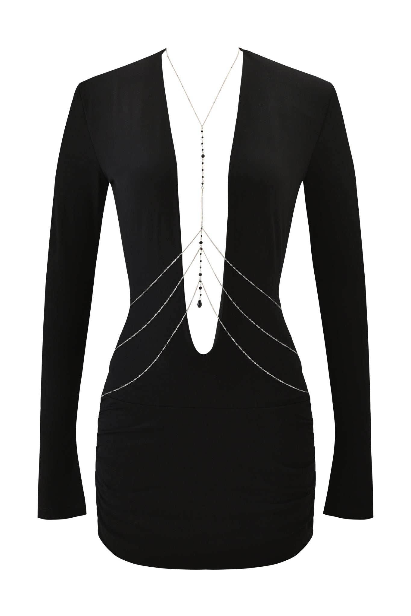 The PADMA MINI DRESS - BLACK by I.AM.GIA is a black bodycon mini dress with long sleeves, padded shoulders, a deep V-neckline, ruched skirt, and a detachable body chain draped across the chest and waist. Displayed on a white background.