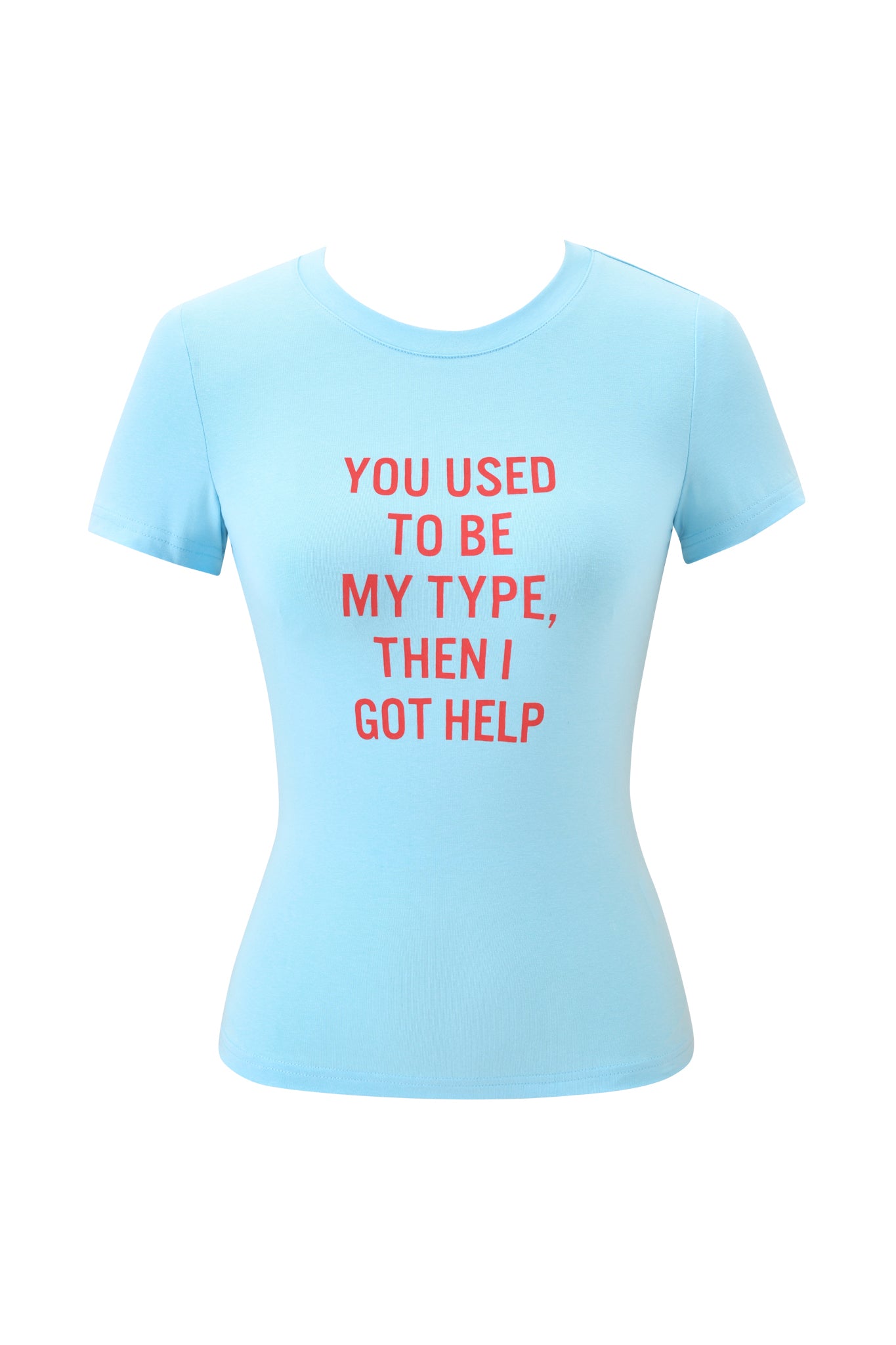 The POLINA TEE - TYPE by I.AM.GIA is a light blue graphic baby tee featuring bold red text on the front: "YOU USED TO BE MY TYPE, THEN I GOT HELP.