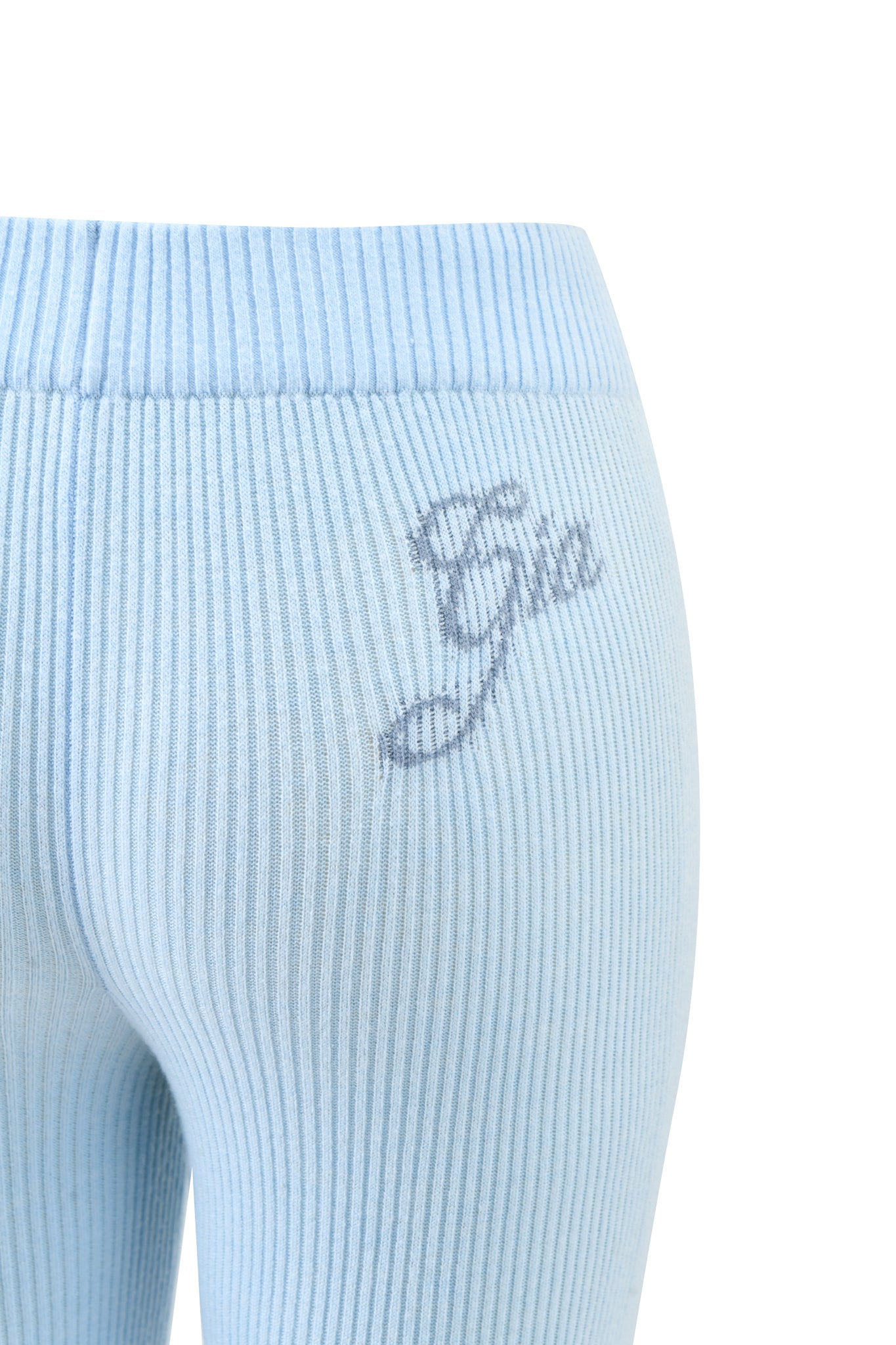 A close-up of the BLARE KNIT TRACKPANT - BLUE by I.AM.GIA, featuring a mid-rise elasticated waistband and flared leg opening.