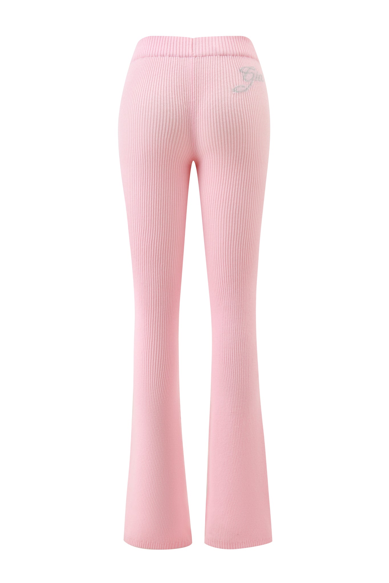 The BLARE KNIT TRACKPANT - PINK by I.AM.GIA features a mid-rise elastic waistband, slight flare leg, and a small logo on the upper right back near the waistband. Seen from the back.