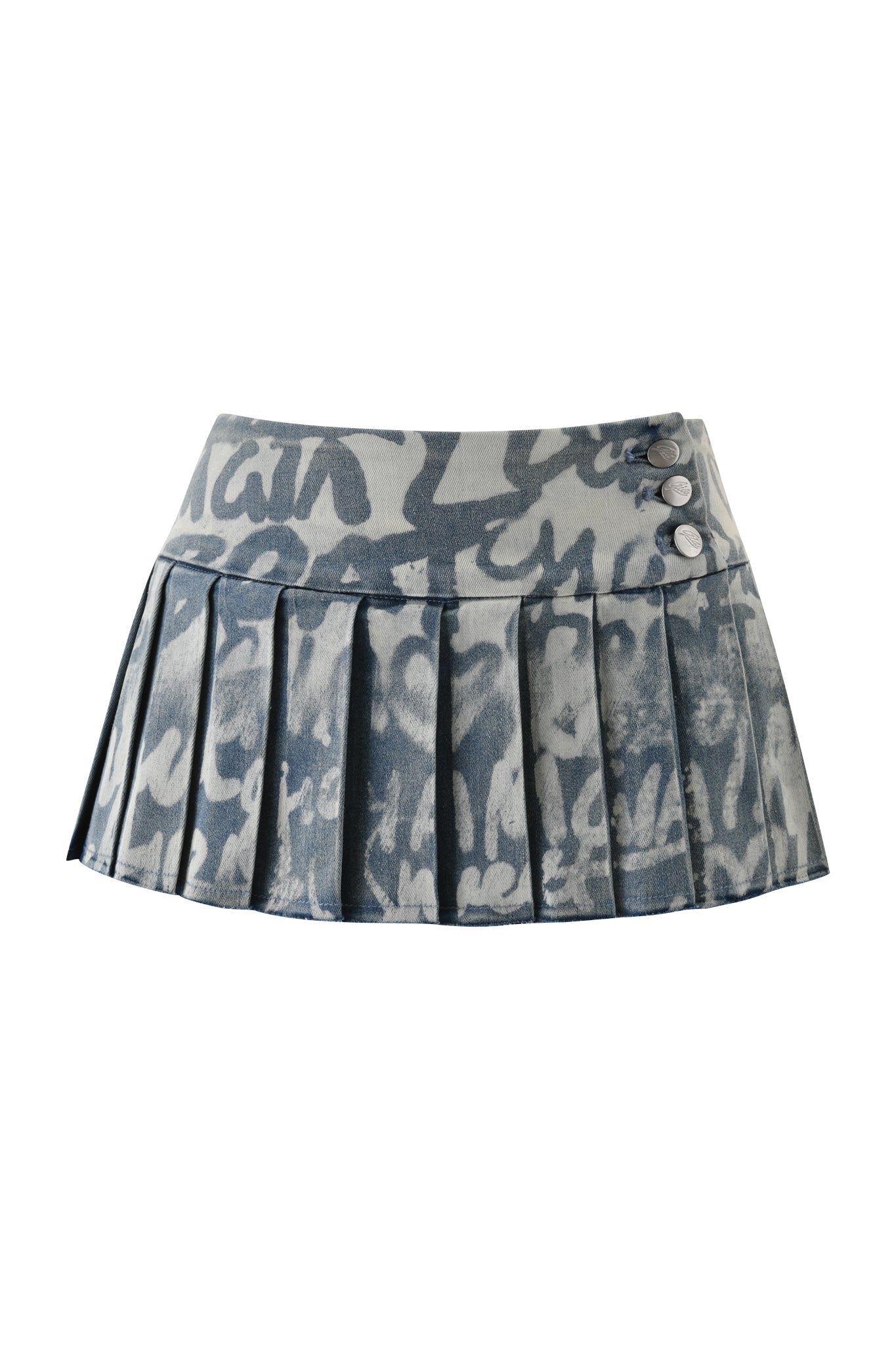The REMINI DISTRESSED DENIM SKORT - GRAFFITI LIGHT WASH by I.AM.GIA is a short, pleated denim skort in a blue and white graffiti print with three silver buttons on the waistband's side.