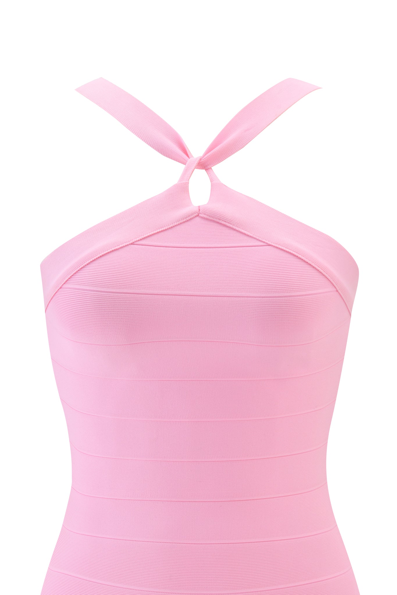 A close-up of the VESPERA BANDAGE MINI DRESS in pink by I.AM.GIA, showcasing its baby pink hue and halter neckline with two straps crossed and knotted at the front.