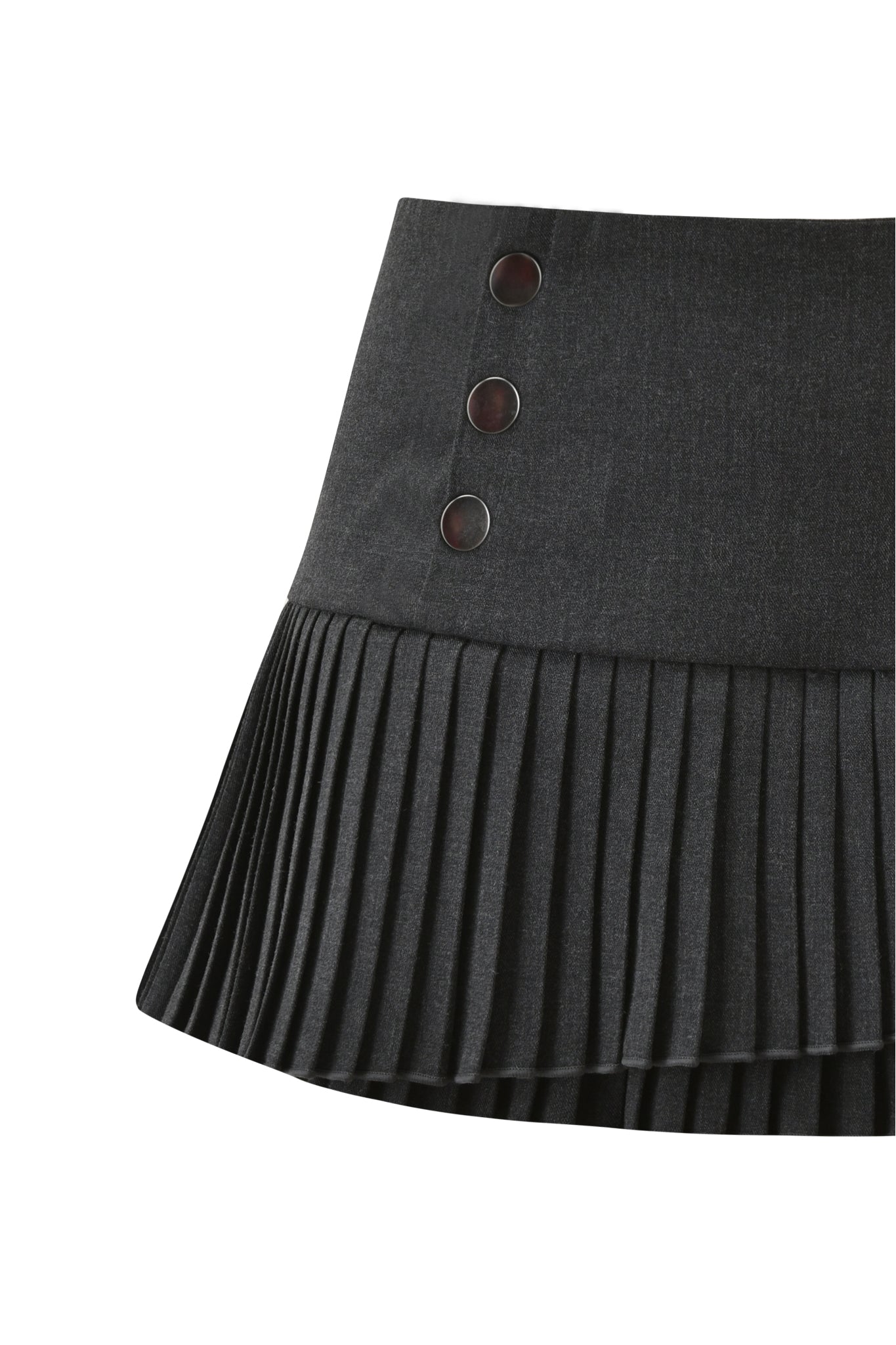 A close-up of the I.AM.GIA KERRA SKORT in charcoal features pleats and three round black buttons on the waistband, displayed against a white background.