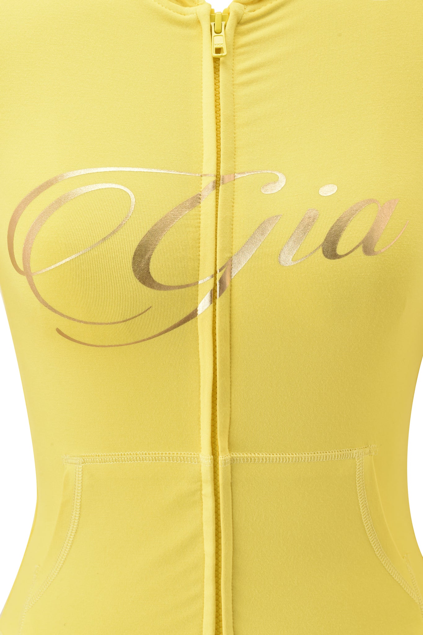 Close-up of the I.AM.GIA BLARE FORM POCKET HOODIE in yellow, featuring "Gia" in large metallic gold foil script across the chest, with a visible zipper and part of the front pocket.