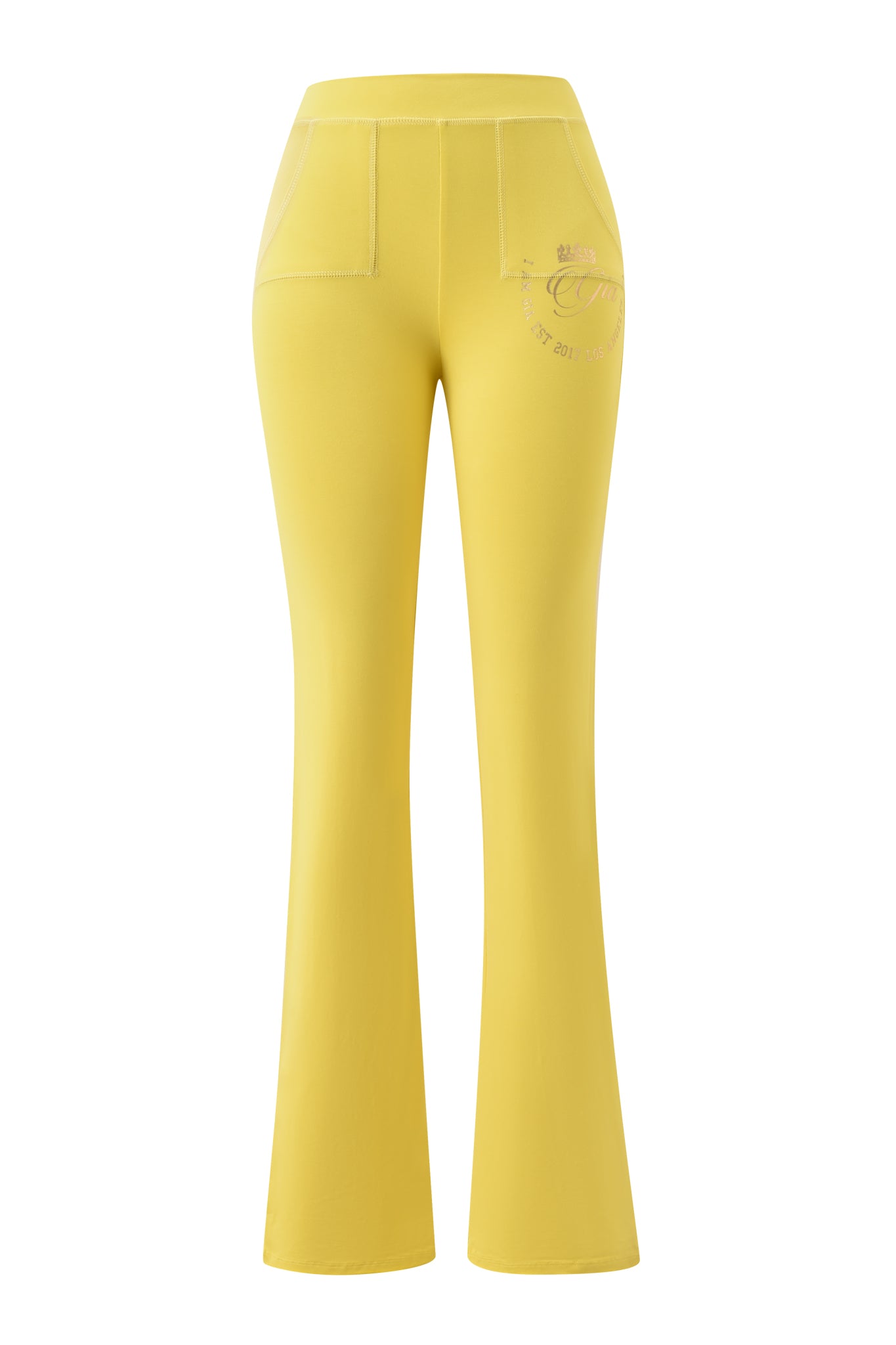 The I.AM.GIA BLARE FORM POCKET TRACKPANT in yellow gold foil features a high-waisted, flared leg design with front patch pockets and a subtle logo on the upper left hip, displayed against a white background.