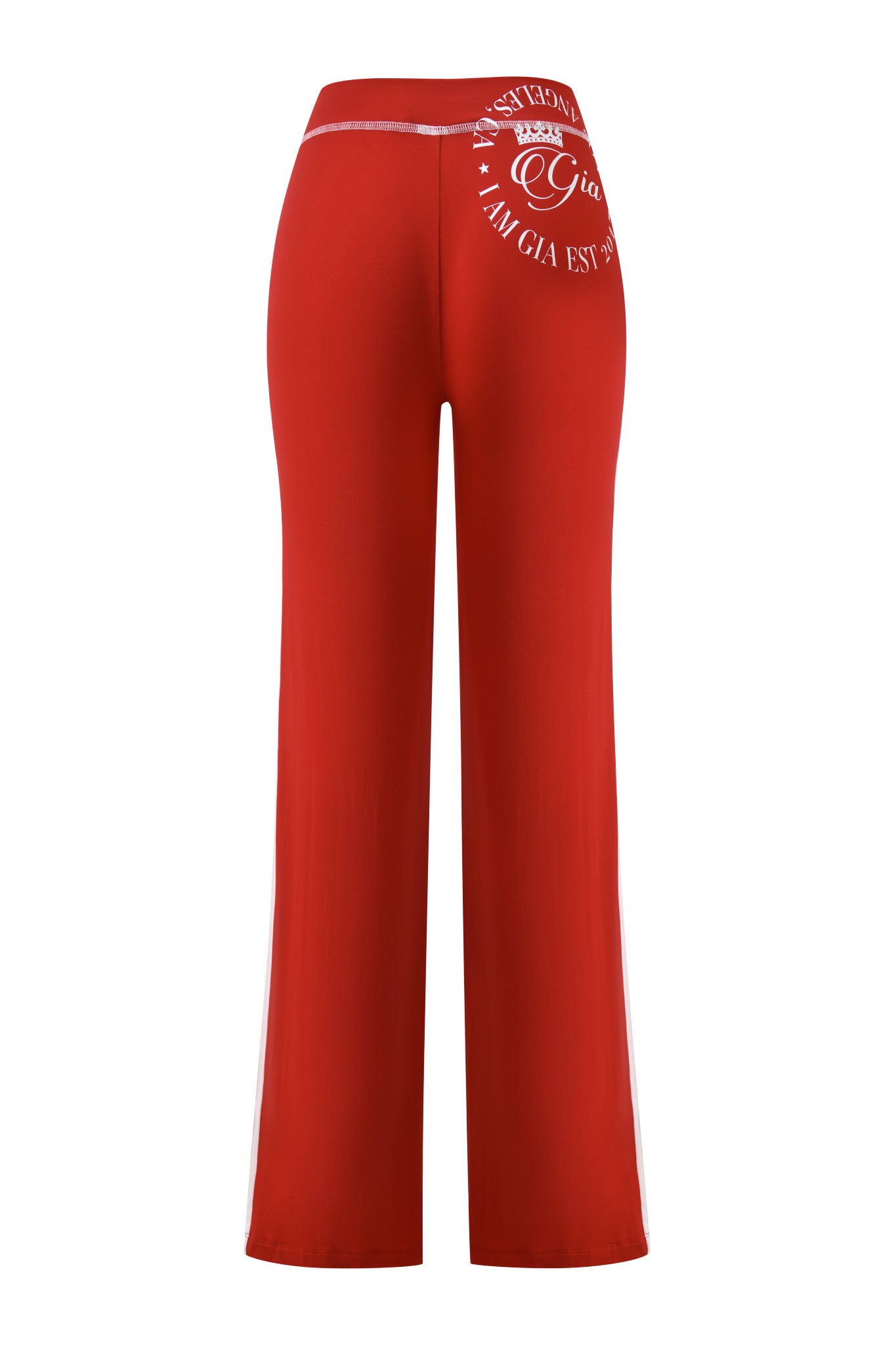 Back view of I.AM.GIA's BLARE PANELLED TRACKPANT in red, featuring a white logo and text near the waistband, elastic waist, smooth fabric, and straight leg design.