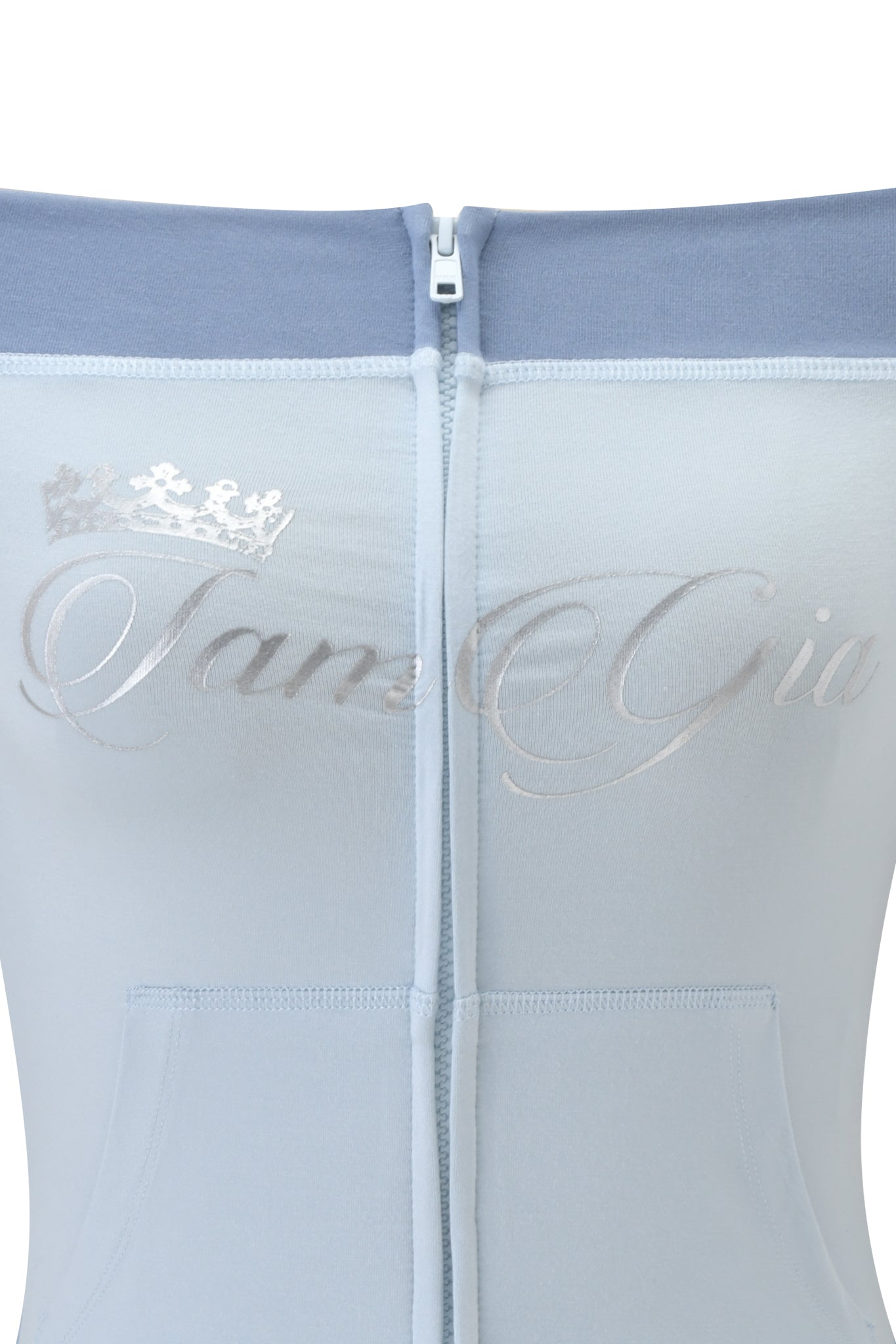 A close-up of the zipper on the I.AM.GIA BLARE OFF SHOULDER TOP - TWO TONE POWDER BLUE, crafted from buttery-soft viscose fabric.