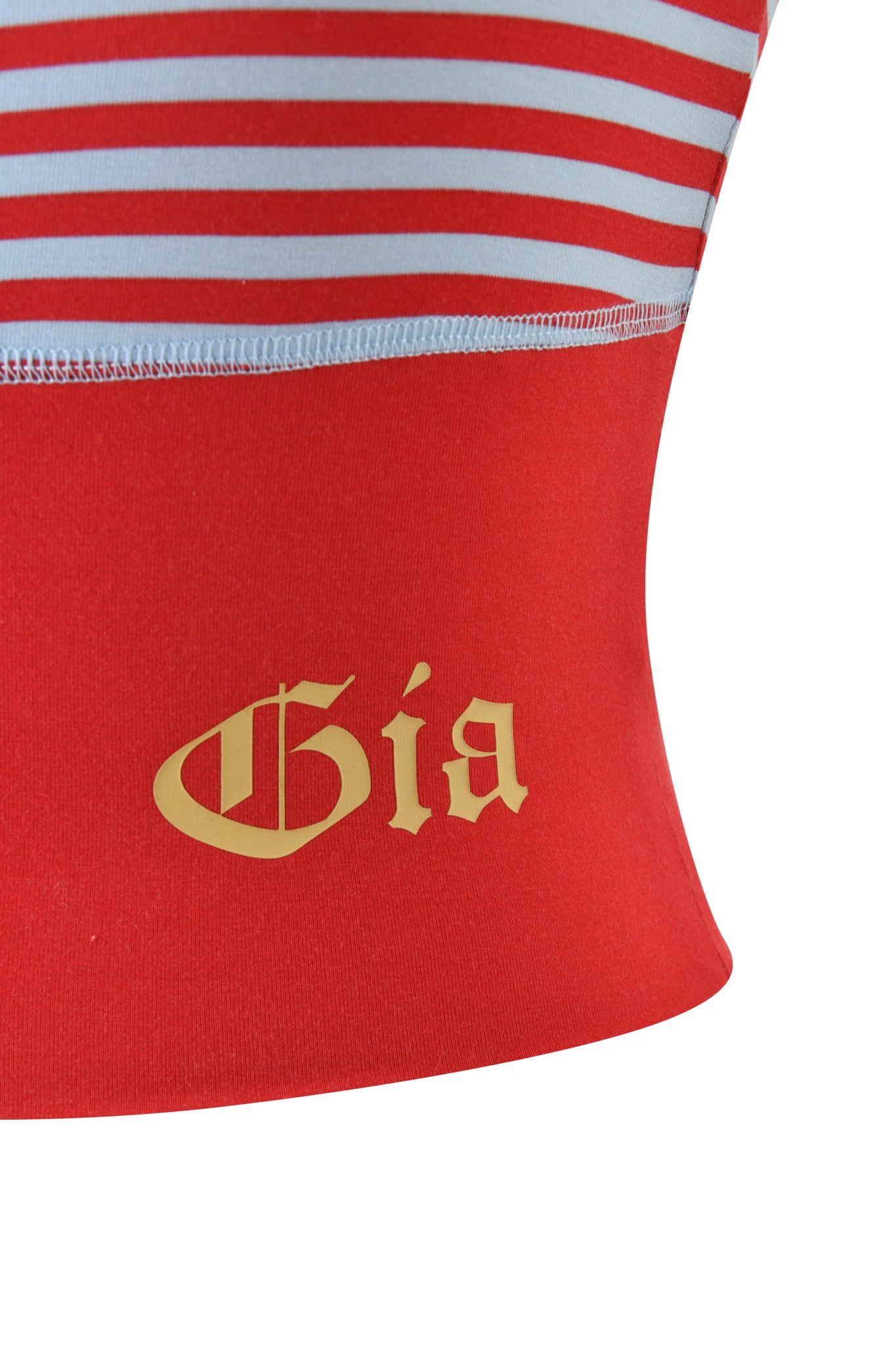 The BLARE ZIP BOOB TUBE by I.AM.GIA features bold red and blue stripes with "Gia" in yellow Gothic letters on the solid red panel, crafted from buttery-soft fabric for ultimate comfort.
