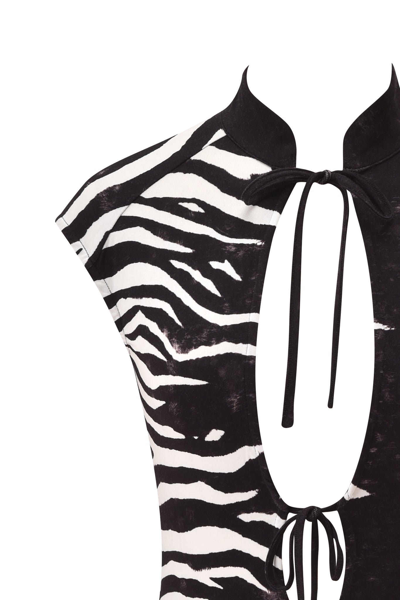 Close-up of the GEORGIA TOP - BLACK WILD SIDE by I.AM.GIA, showcasing a bold zebra print design with cap sleeves, a high collar, and two keyhole cutouts on the chest accented by delicate black tie-up strings.