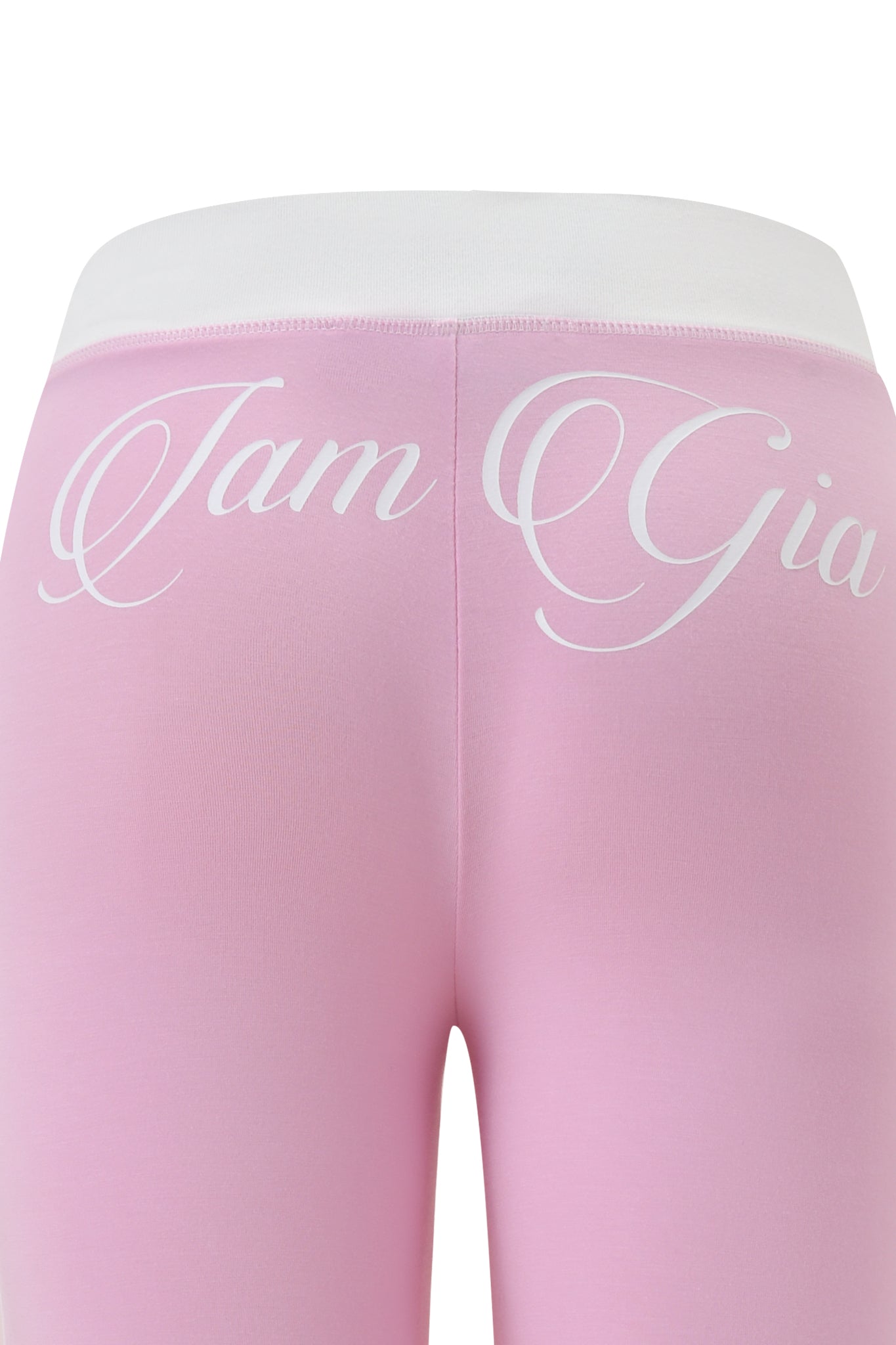 Close-up of the back of the BLARE PIPING TRACKPANT in baby pink and white by I.AM.GIA, featuring a white waistband and “I.AM.GIA” elegantly scripted across the upper back.