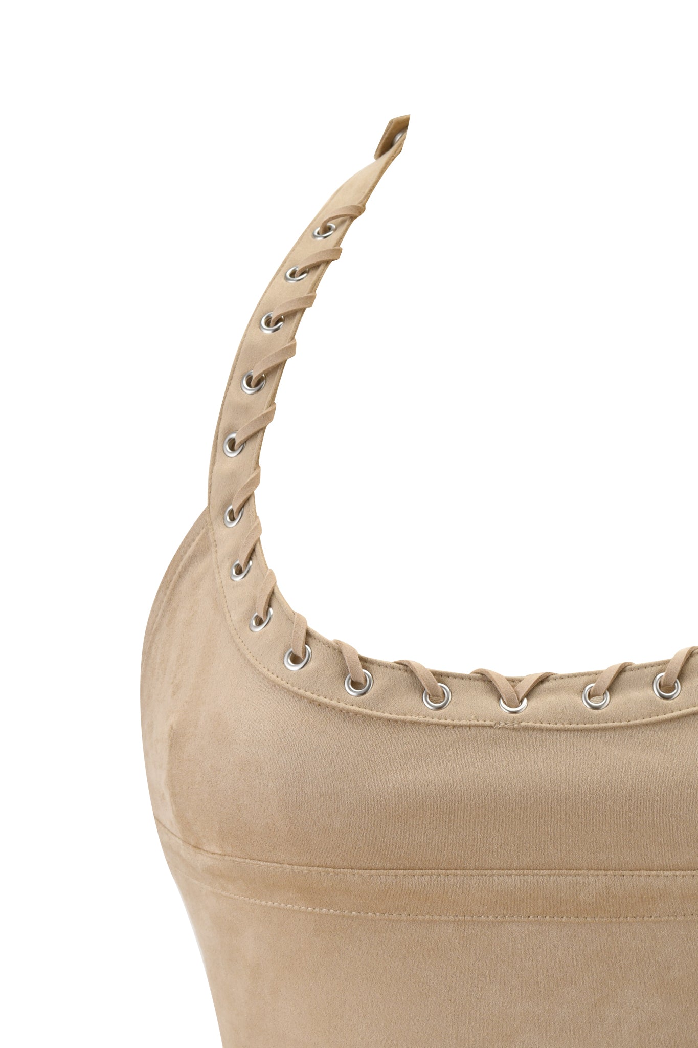 Close-up of the ZEPHYR CAMI TOP - TAN by I.AM.GIA, a beige faux suede halter with lace-up metal eyelet detail along one strap and neckline. The fabric is soft with a slight texture.