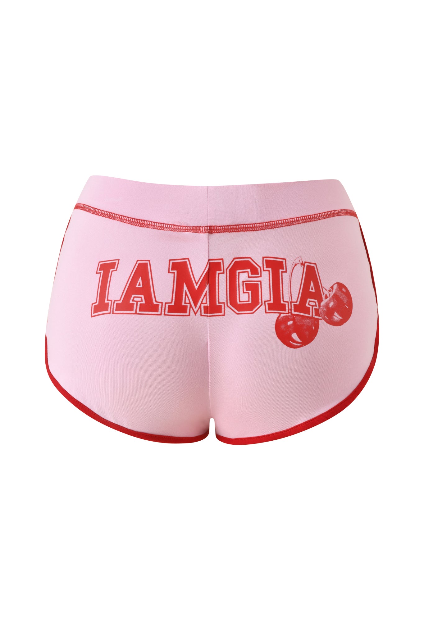 The BLARE DOLPHIN SHORT - BABY PINK by I.AM.GIA updates the classic cherry shorts style with baby pink fabric, bold red "IAMGIA" text, and a playful two-cherry print on the back, all finished with striking red trim.