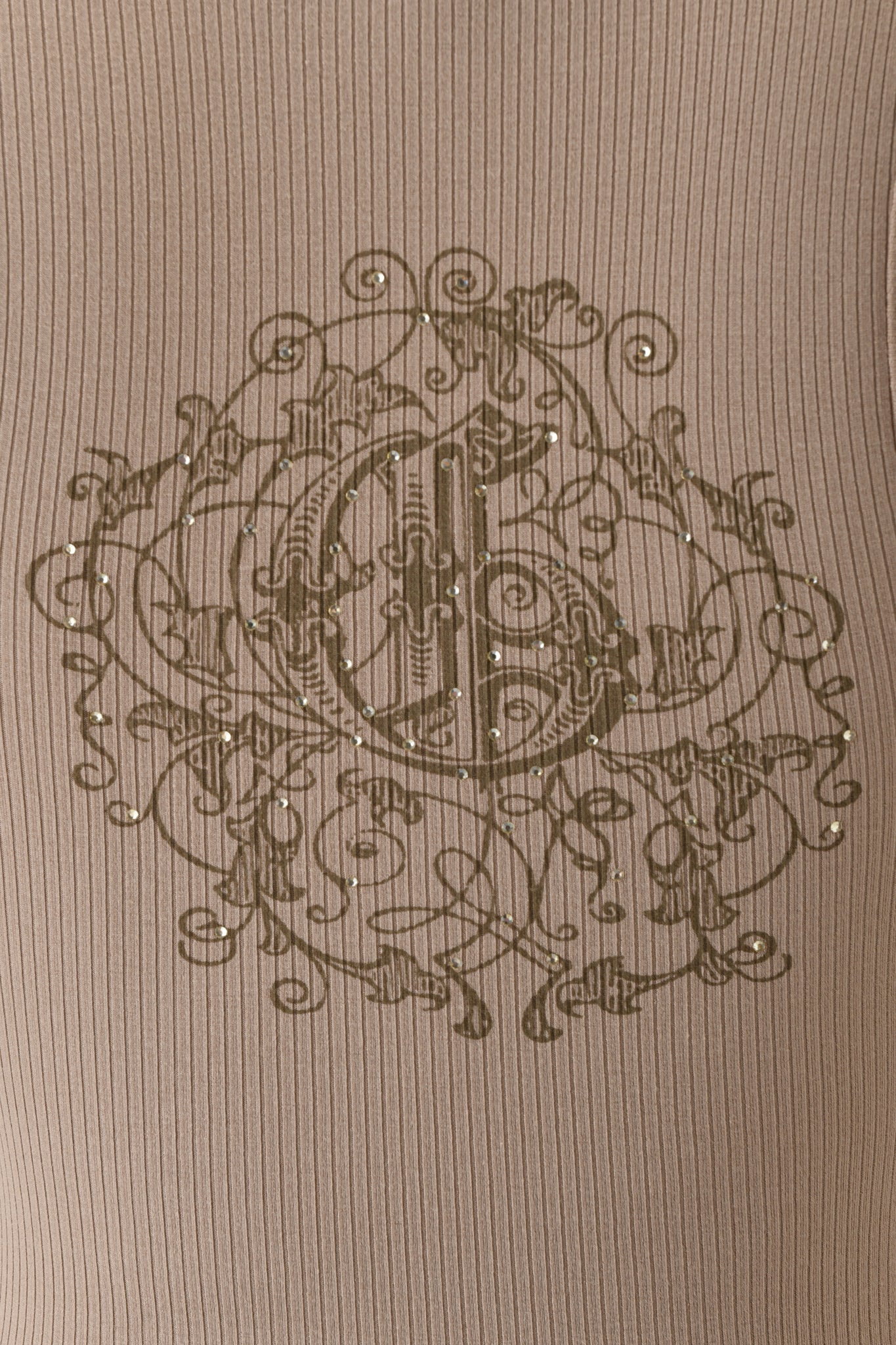 Close-up of the I.AM.GIA INA TANK in mushroom brown, showcasing a central ornate circular floral motif with swirls, dots, and shimmering rhinestones on the ribbed racer tank.