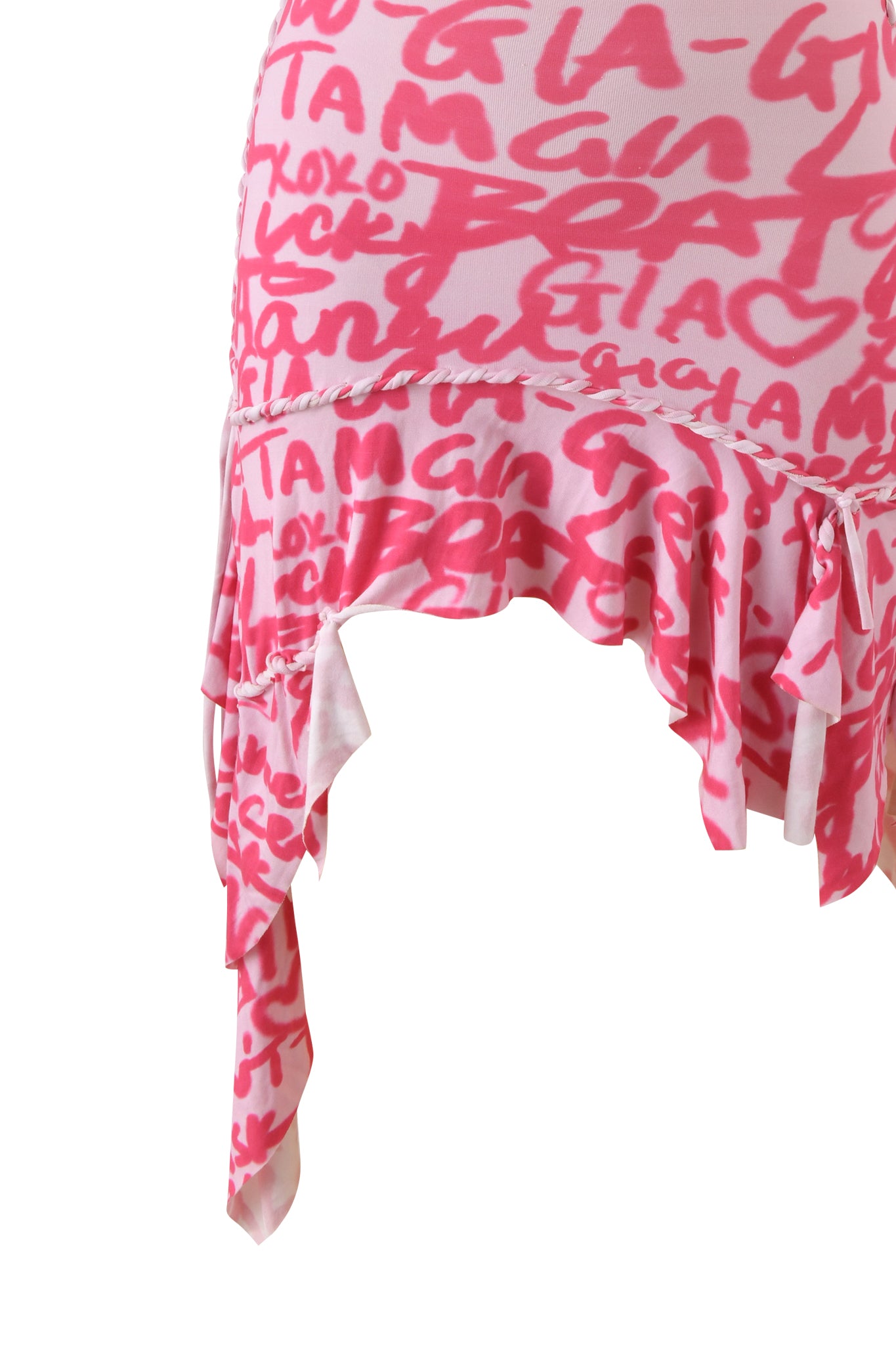 The I.AM.GIA HONEY MACRAME MINI DRESS features bold pink graffiti print and abstract red text, with an asymmetrical ruffled hem and layered edges for a striking sleeveless bodycon look.